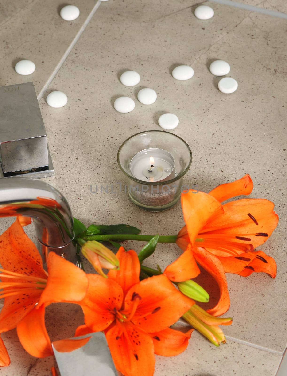candle and  flowers in spa salon.shallow DOF