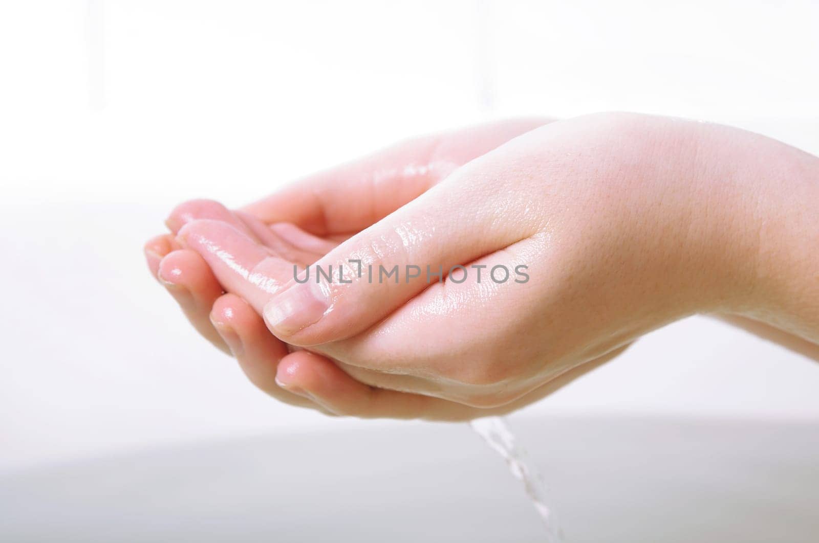 female hands closeup in bath