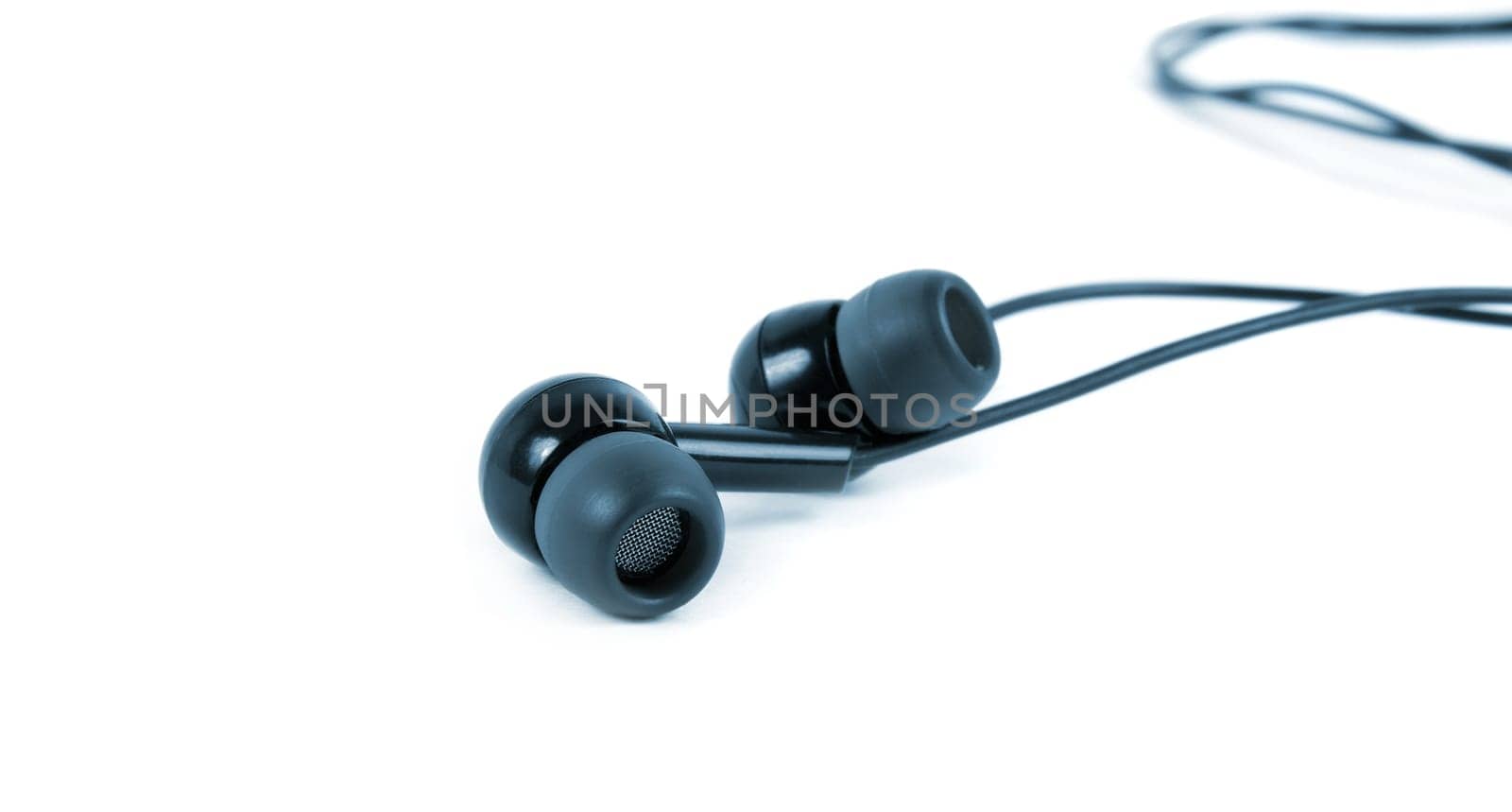 earphones closeup over the white surface.blue tone
