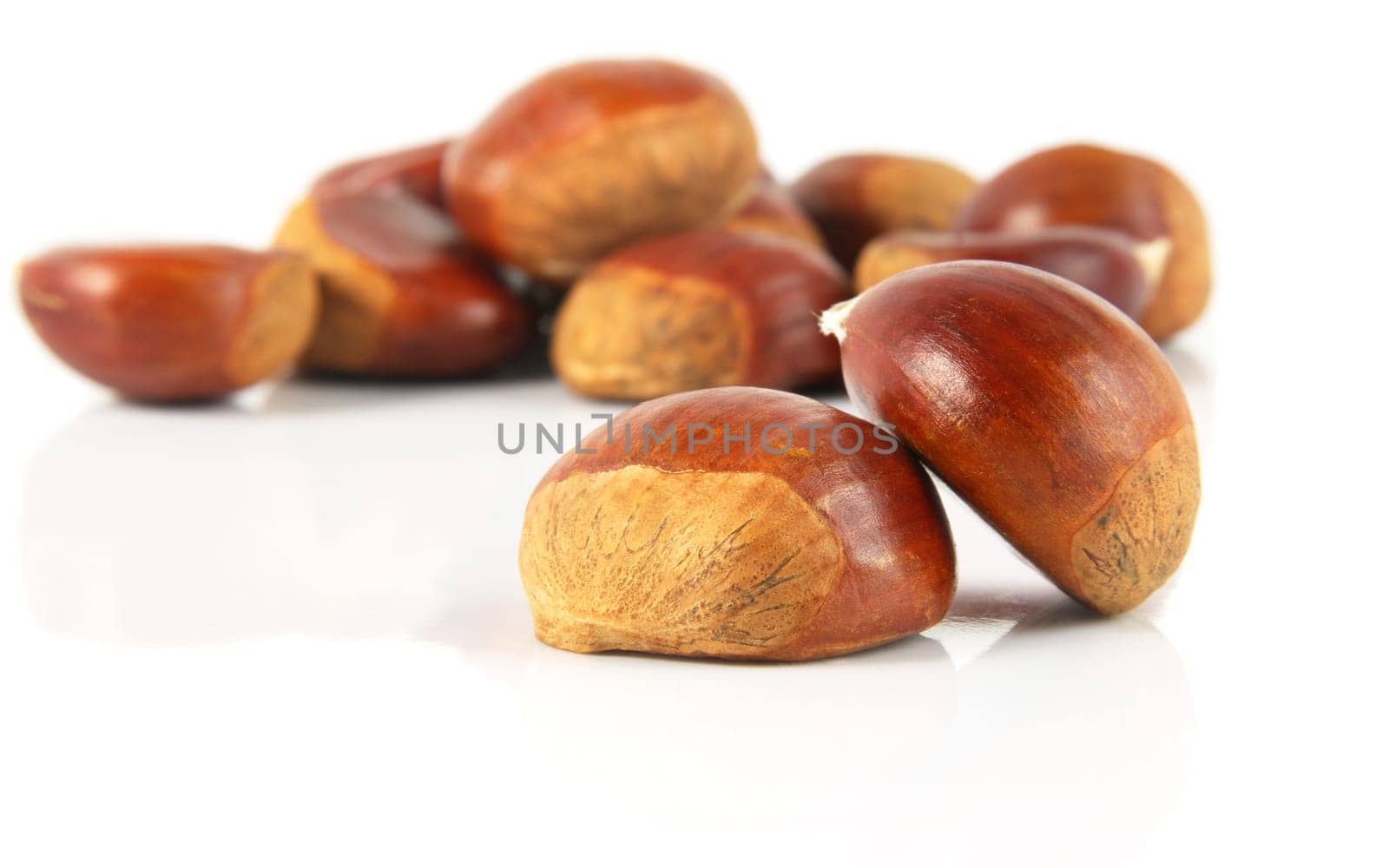 delicious chestnuts closeup over white