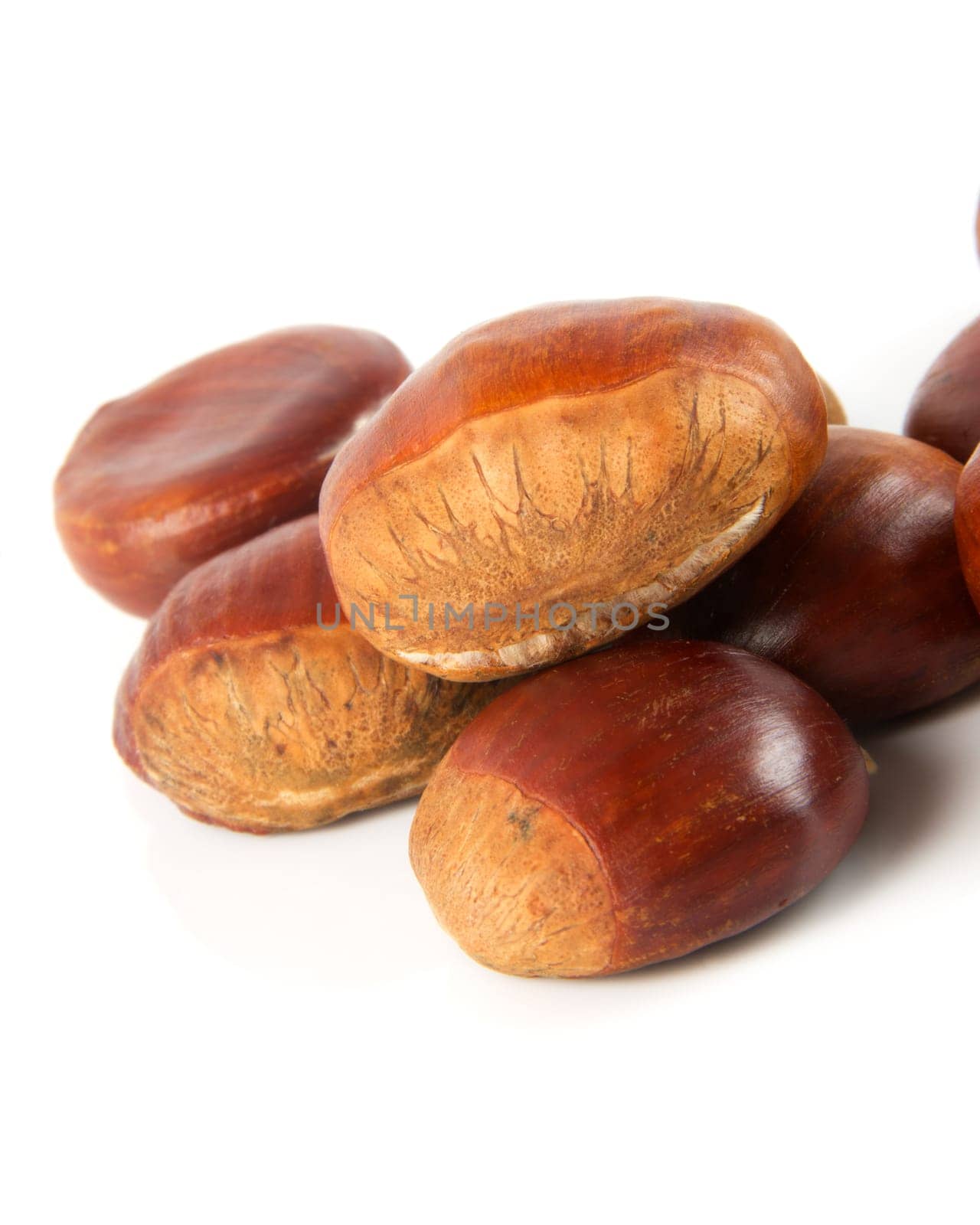 delicious chestnuts closeup over white