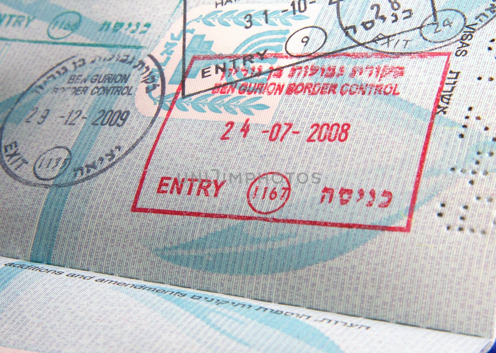 visa stamps in open passport page