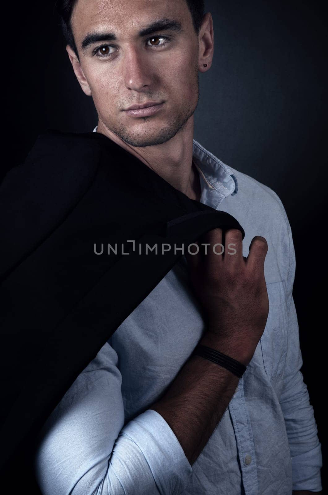 portrait of the elegant man on dark
