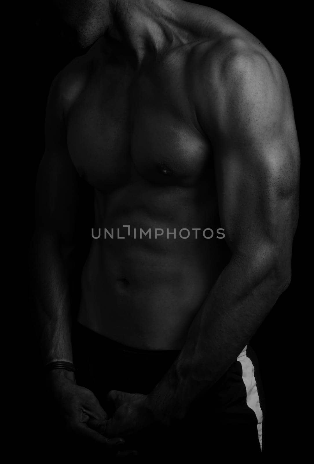 shape of sporty male body on dark