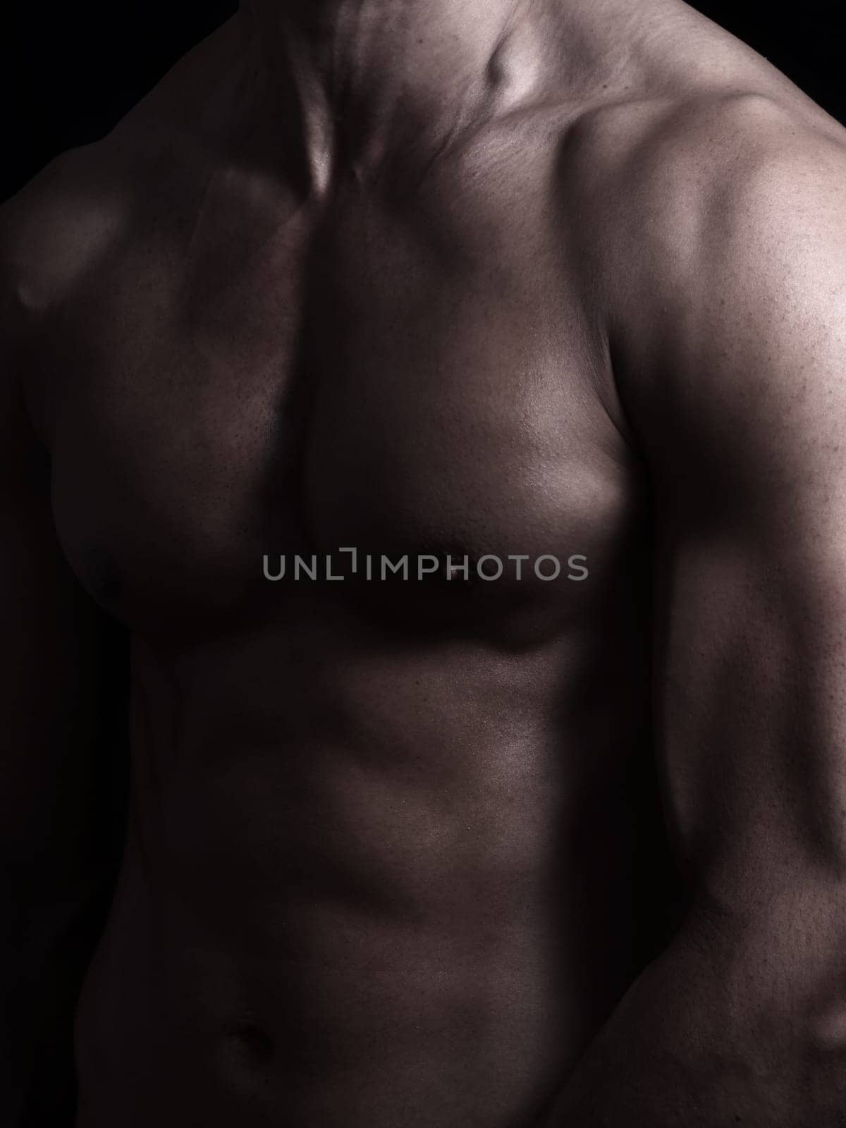shape of sporty male body on dark