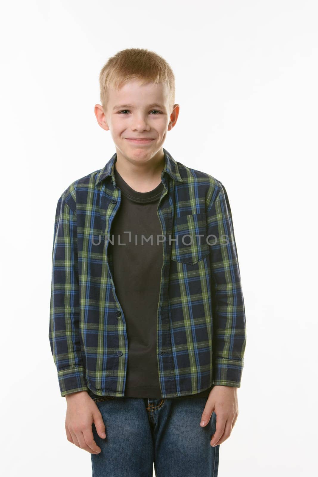Portrait of a laughing young man of ten years on a white background
