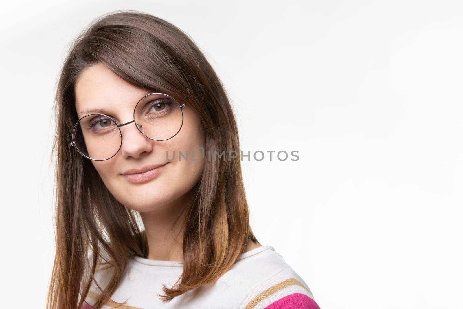 Closeup portrait of european girl in round glasses
