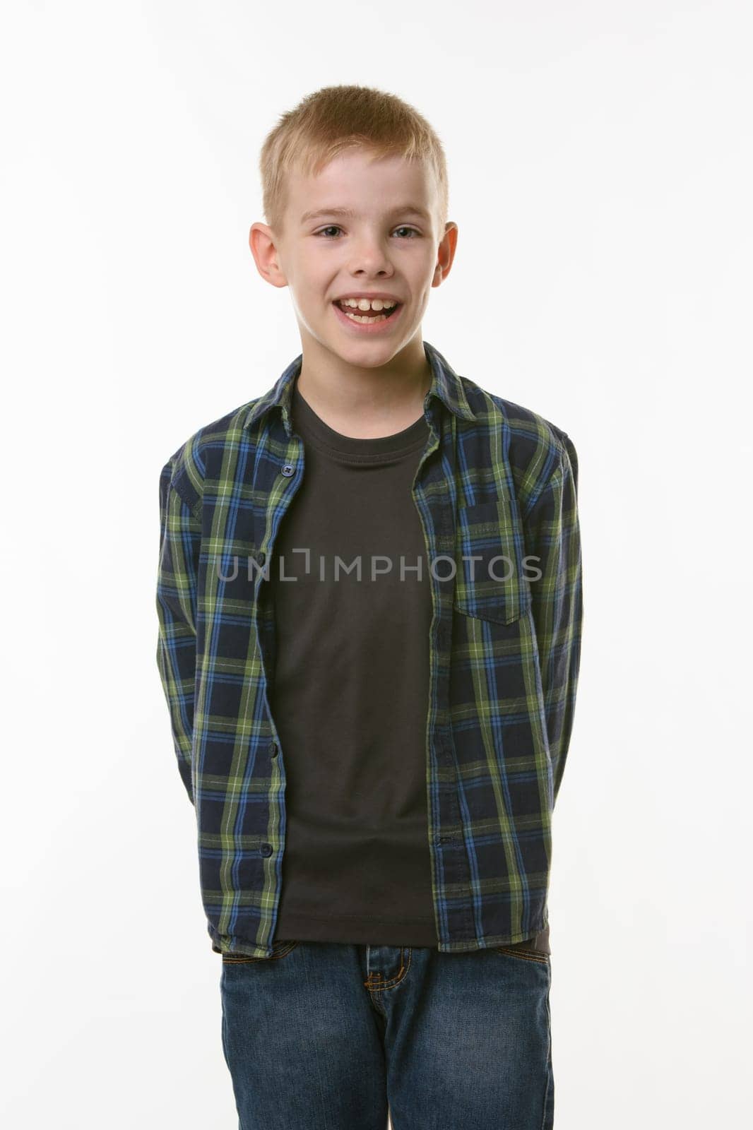 Portrait of a cheerful young man of eleven years on a white background