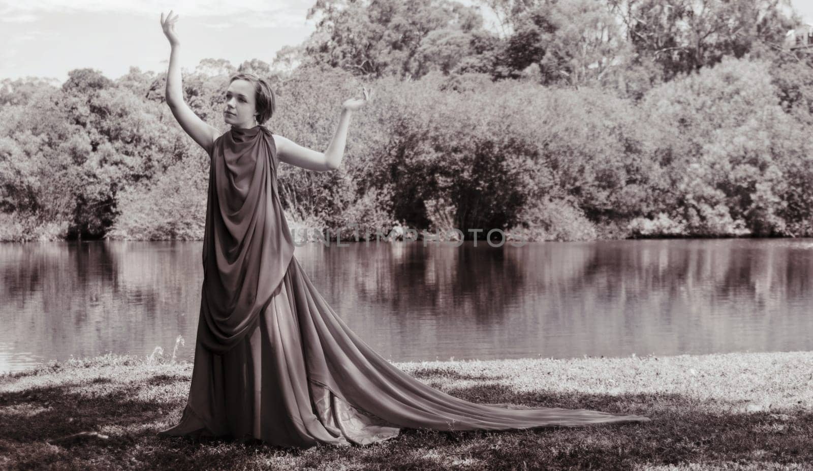 woman with beautiful dress by the lake