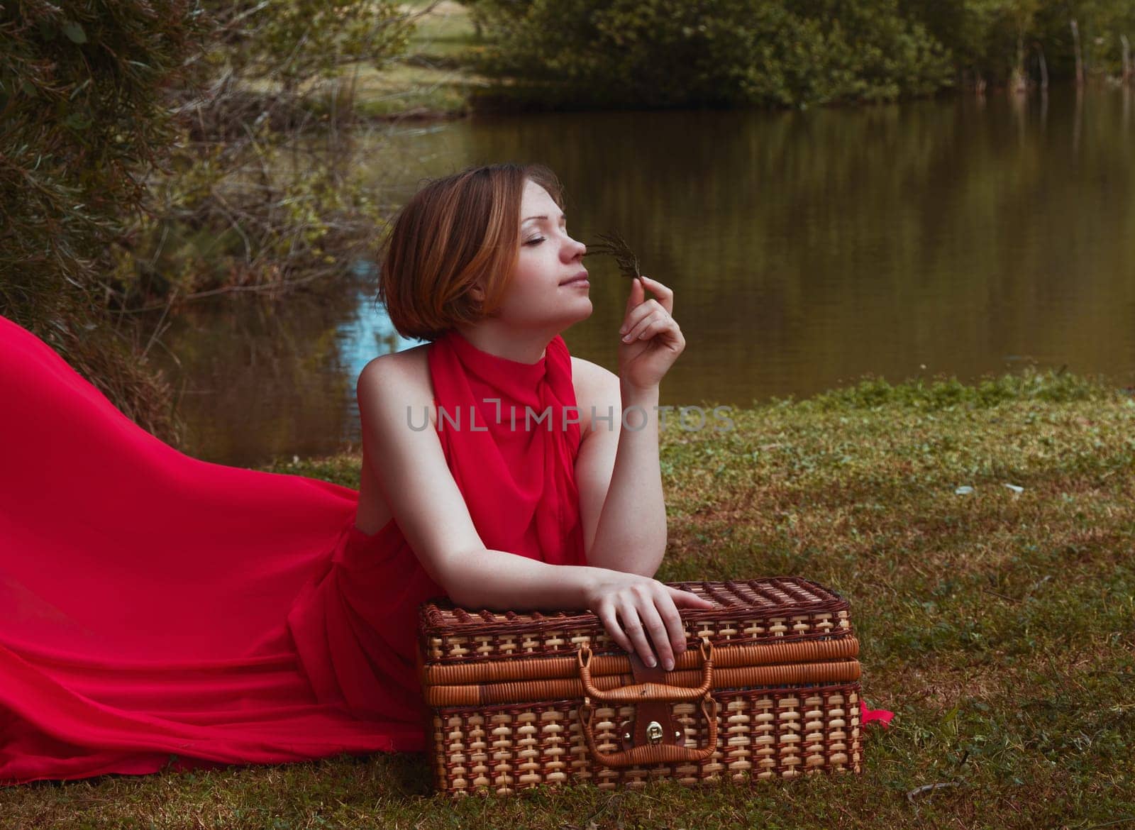 woman with beautiful dress by the lake