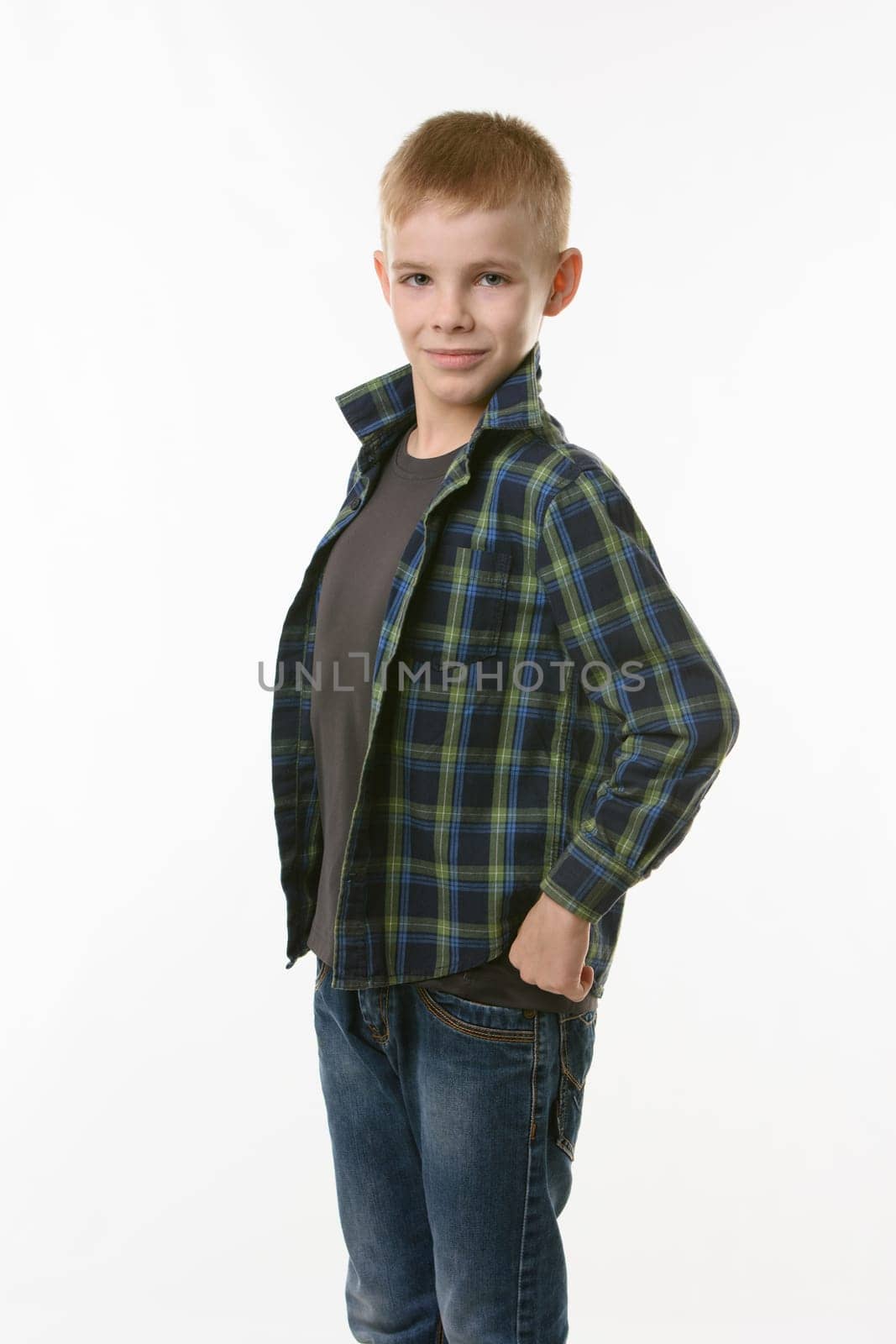 Portrait of a ten year old boy sticking his chest forward