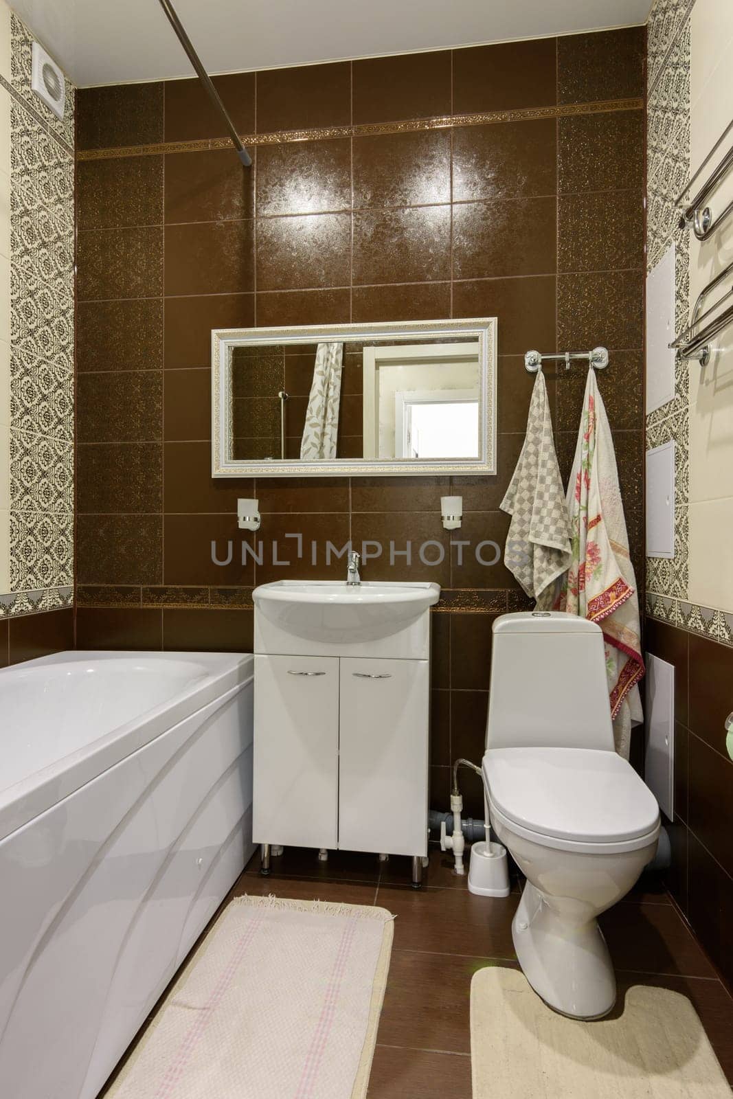 The interior of the bathroom is made in a classic style