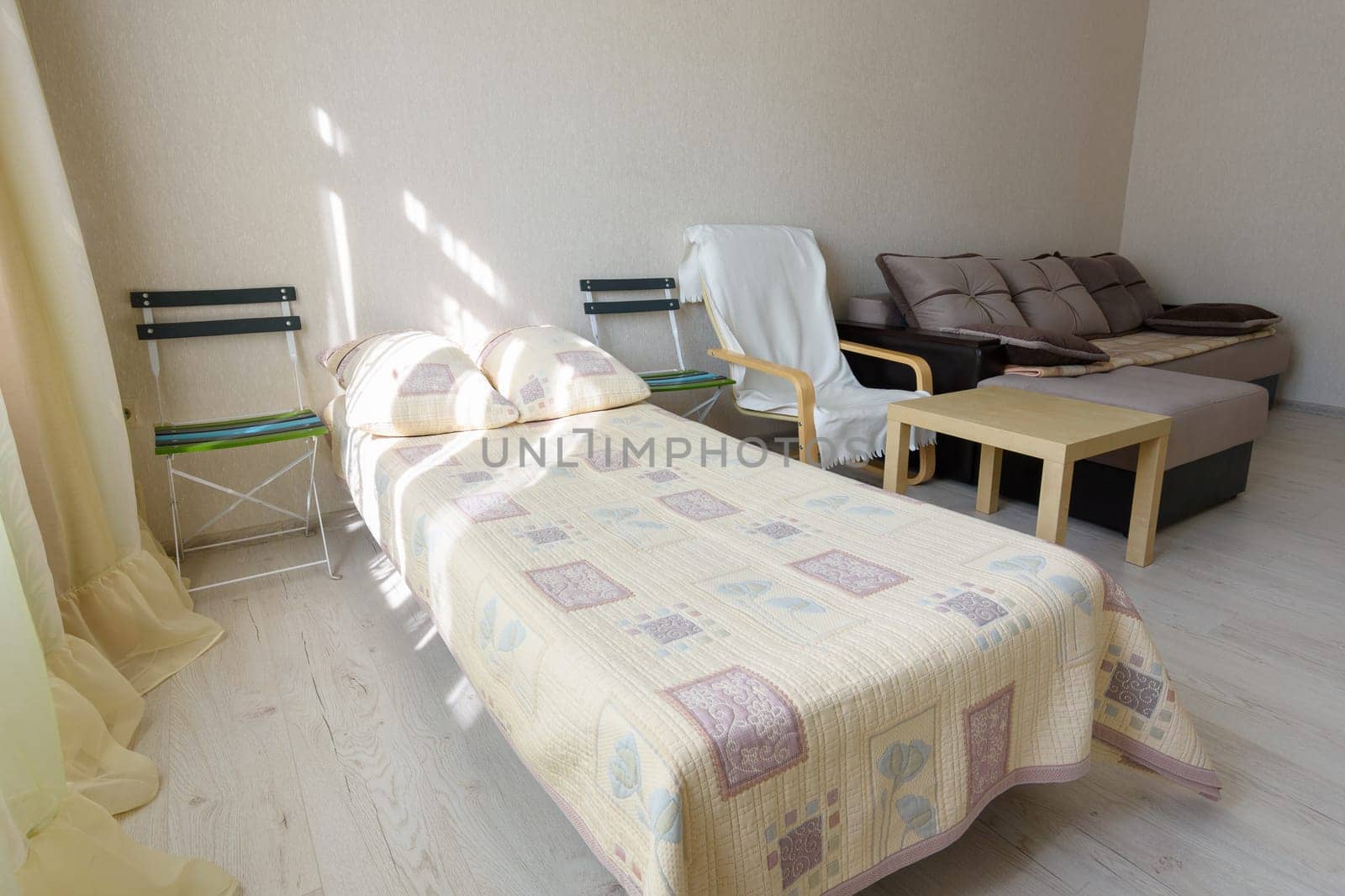 Close-up bed in a bedroom interior of a studio apartment