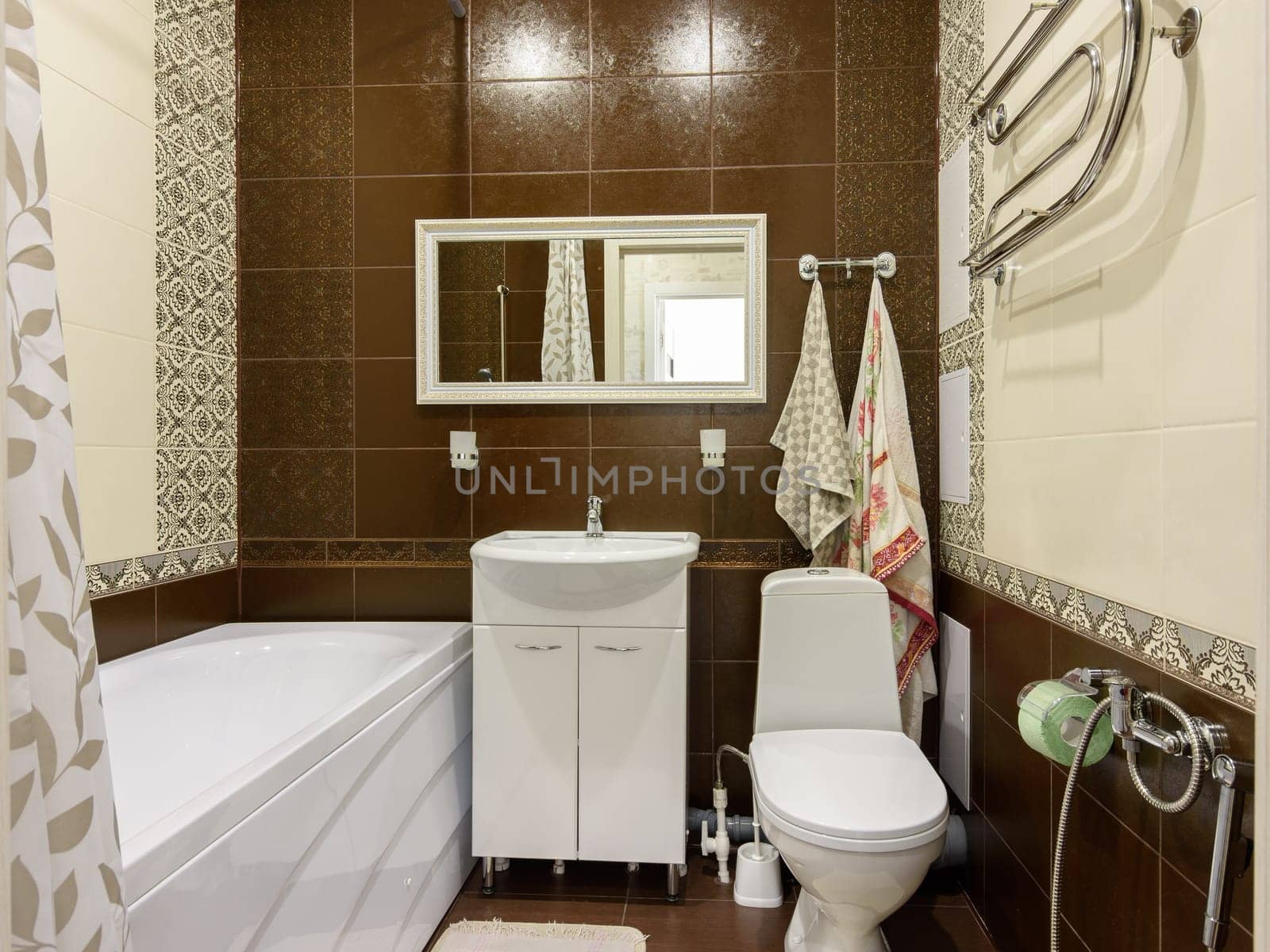 The interior of a small cozy combined bathroom