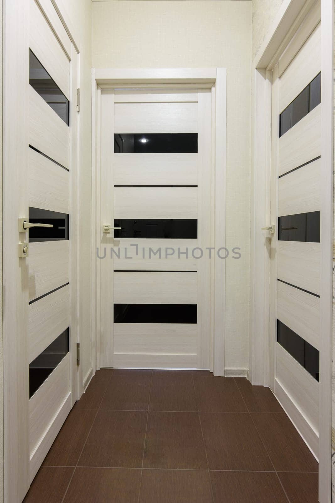 Three closed interior doors in the corridor