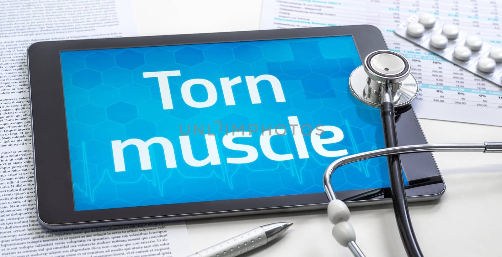 The word Torn muscle on the display of a tablet
