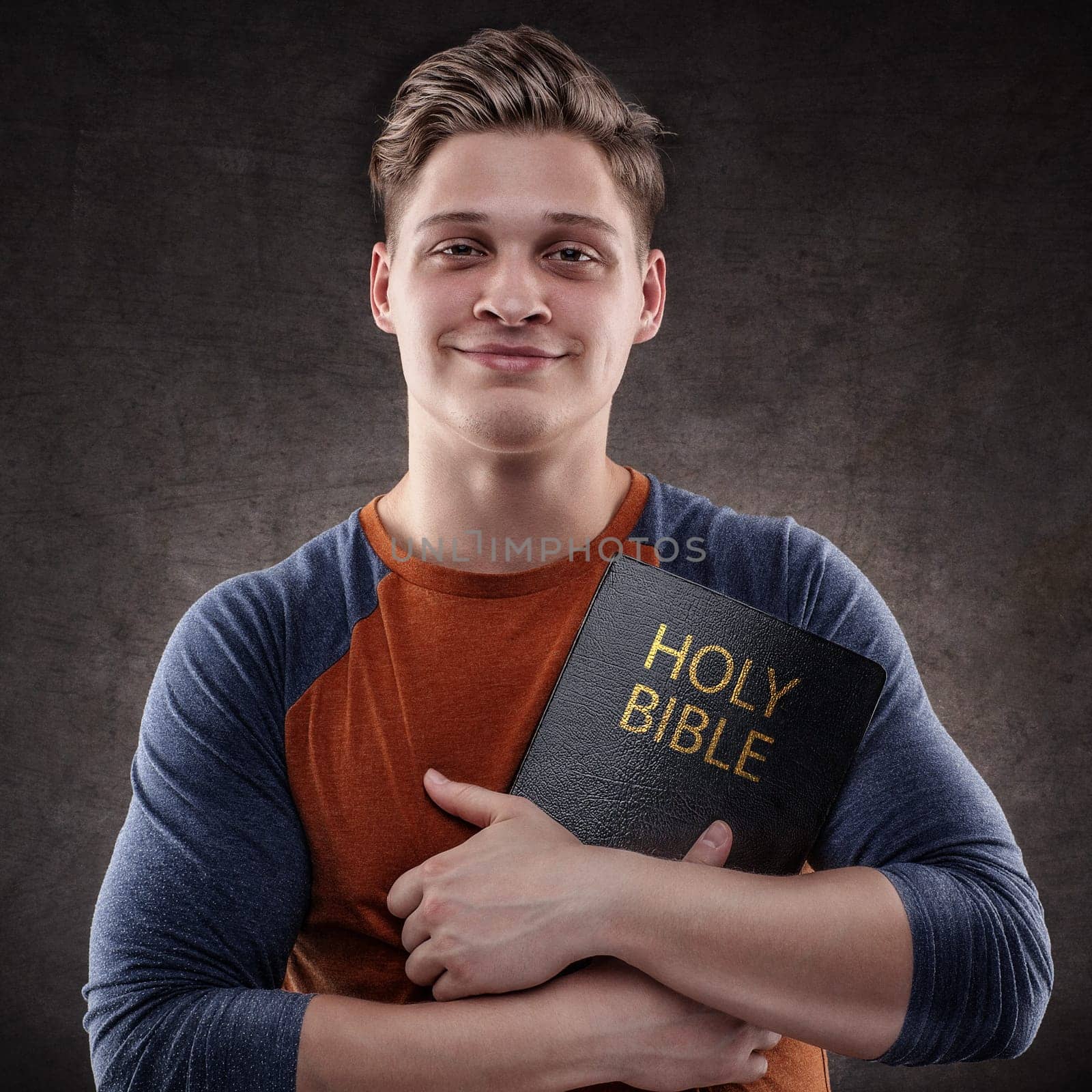 Happy young man embrace his Holy Bible