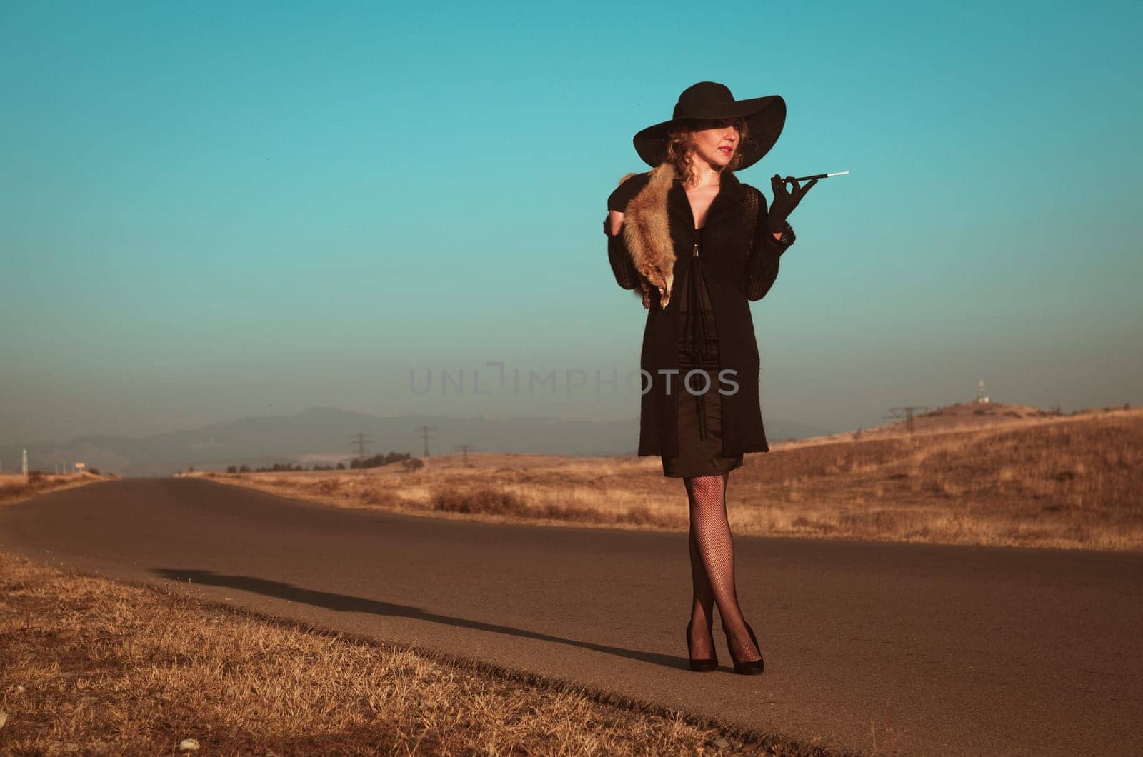Retro beautiful blond woman portrait on road