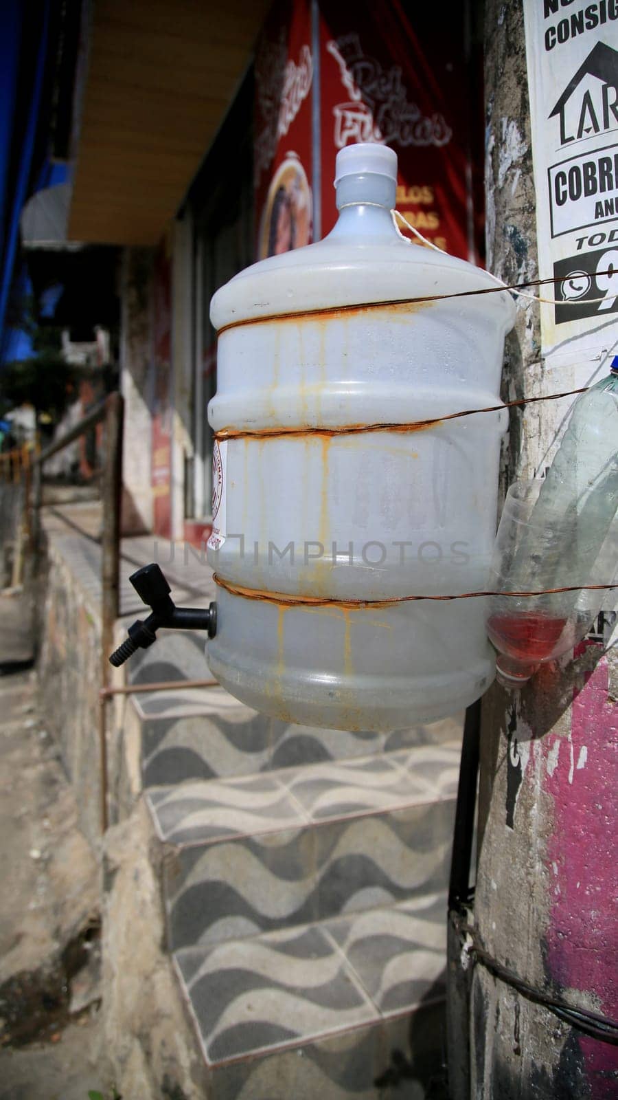 salvador, bahia / brazil - july 1, 2020: improvised system of hand washing seen on the street in the neighborhood of Pernambues, in the city of Salvador.
