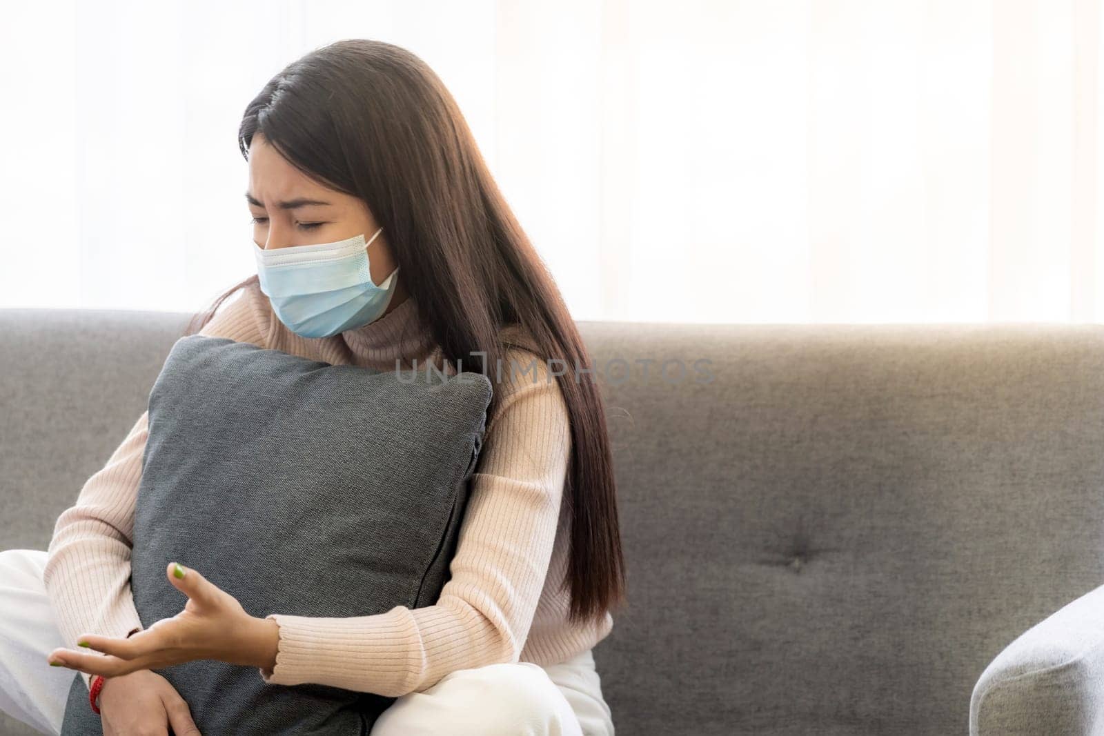 Portait of asian female patient with face mask talking to Psychotherapist doctor for consult about her mental health.