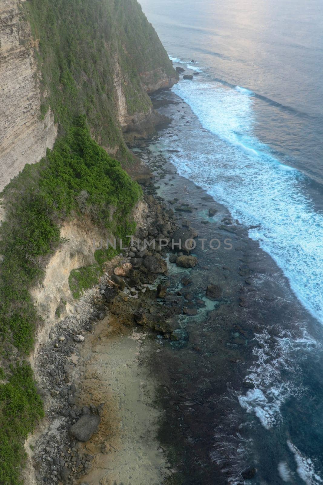 Uluwatu Temple Pura Luhur Uluwatu is a Balinese Hindu sea temple located in Uluwatu. It is renowned for its magnificent location, perched on top of a cliff. Picturesque bright cliff landscape.
