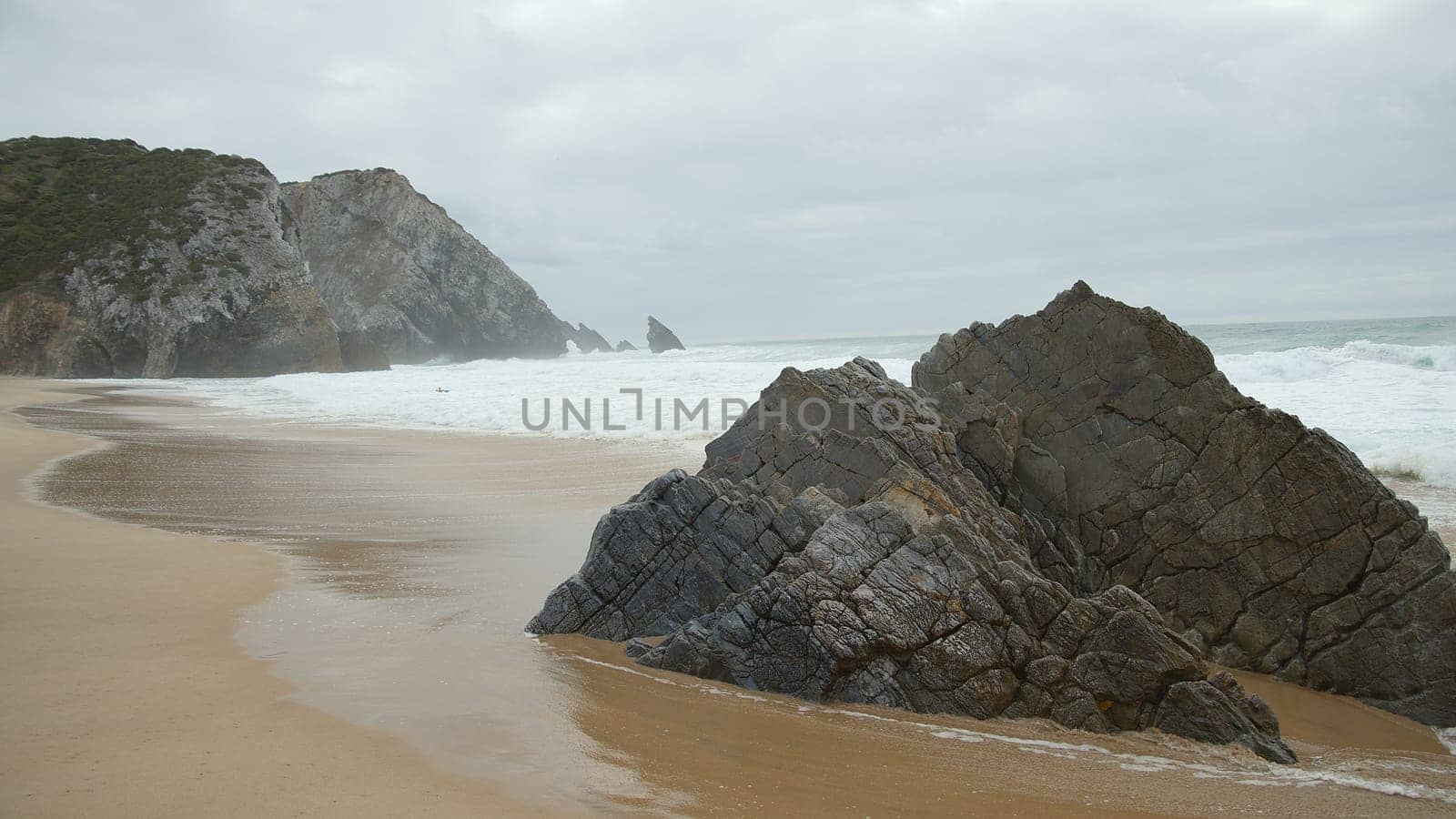 Beautiful Adraga Beach at the Atlantic Ocean coast in Portugal - travel photography