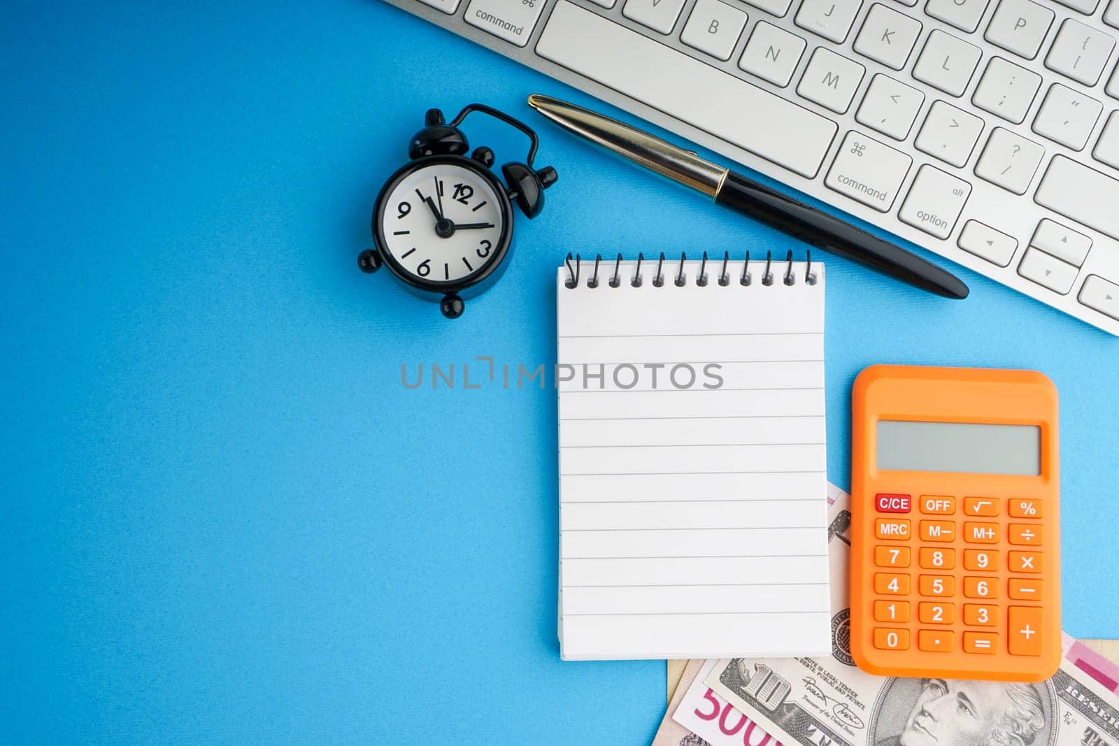 Flat lay of business with office stationary concept on blue background. Business and Copy Space concept