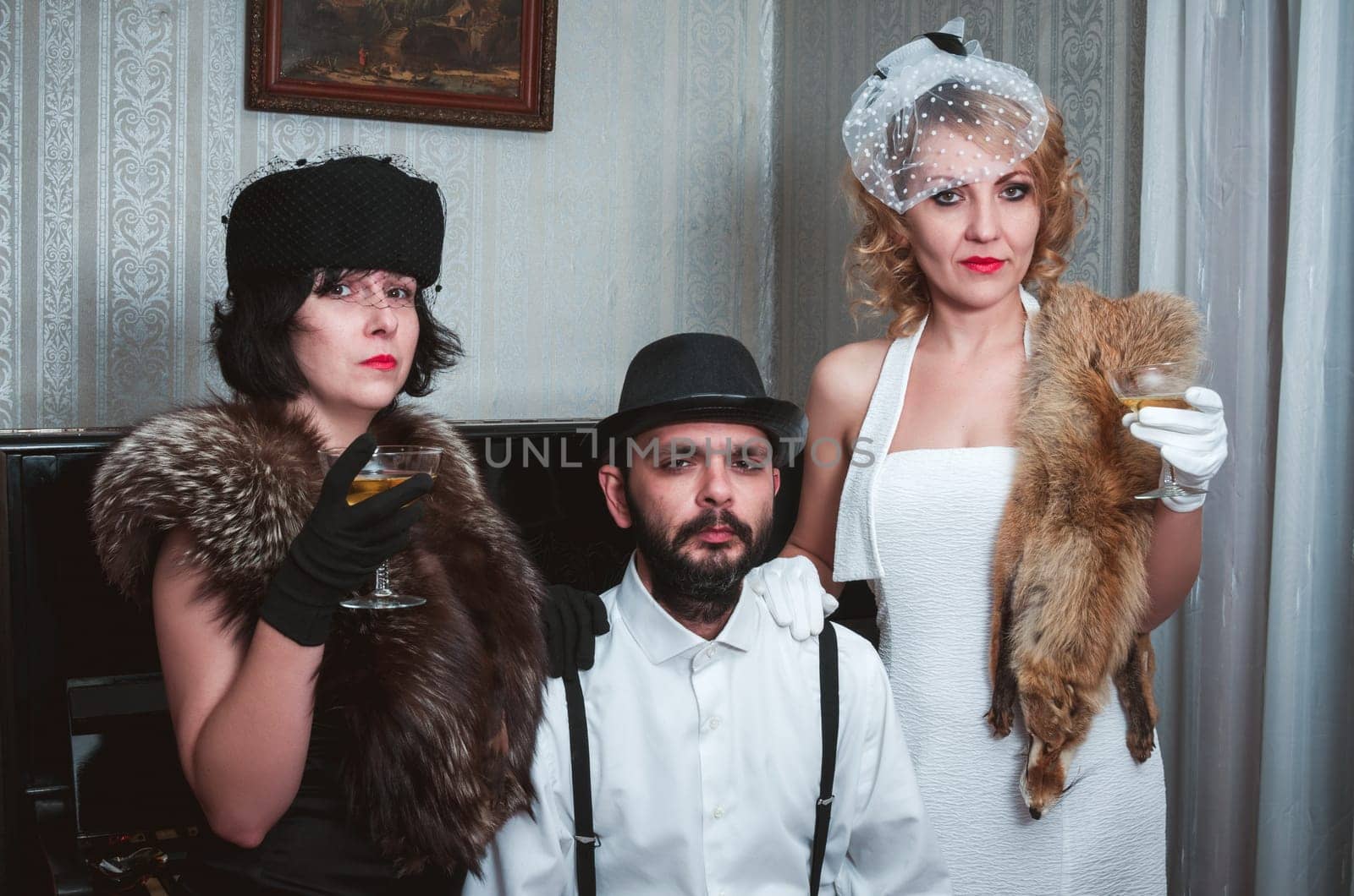 Two retro women and man portrait closeup