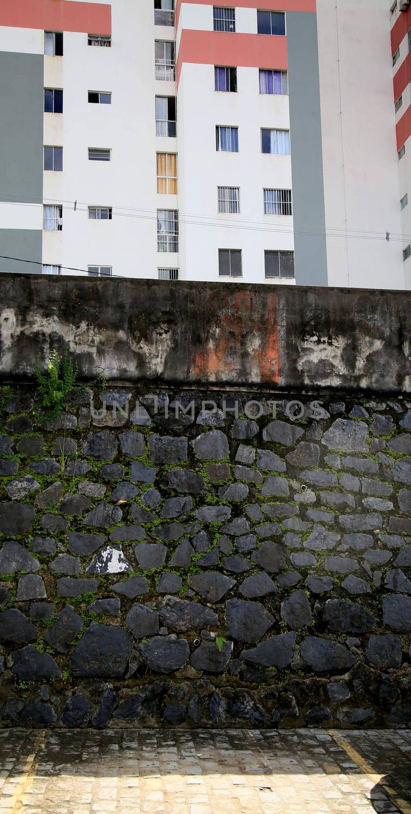 salvador, bahia / brazil - july 2, 2020: stone masonry wall seen in residential condominium in the city of Salvador.