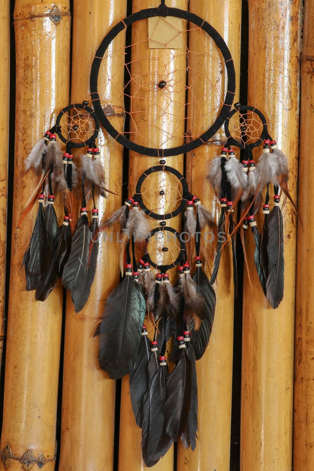 Real native dream catcher on pure natural wooden background.
