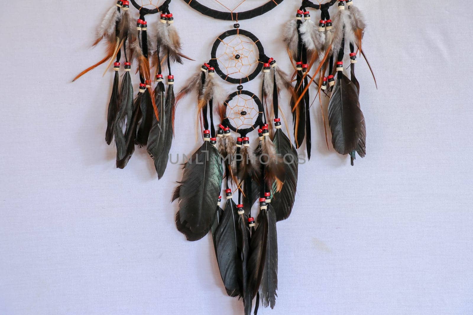 Macro view of real native dream catcher details on pure white background.