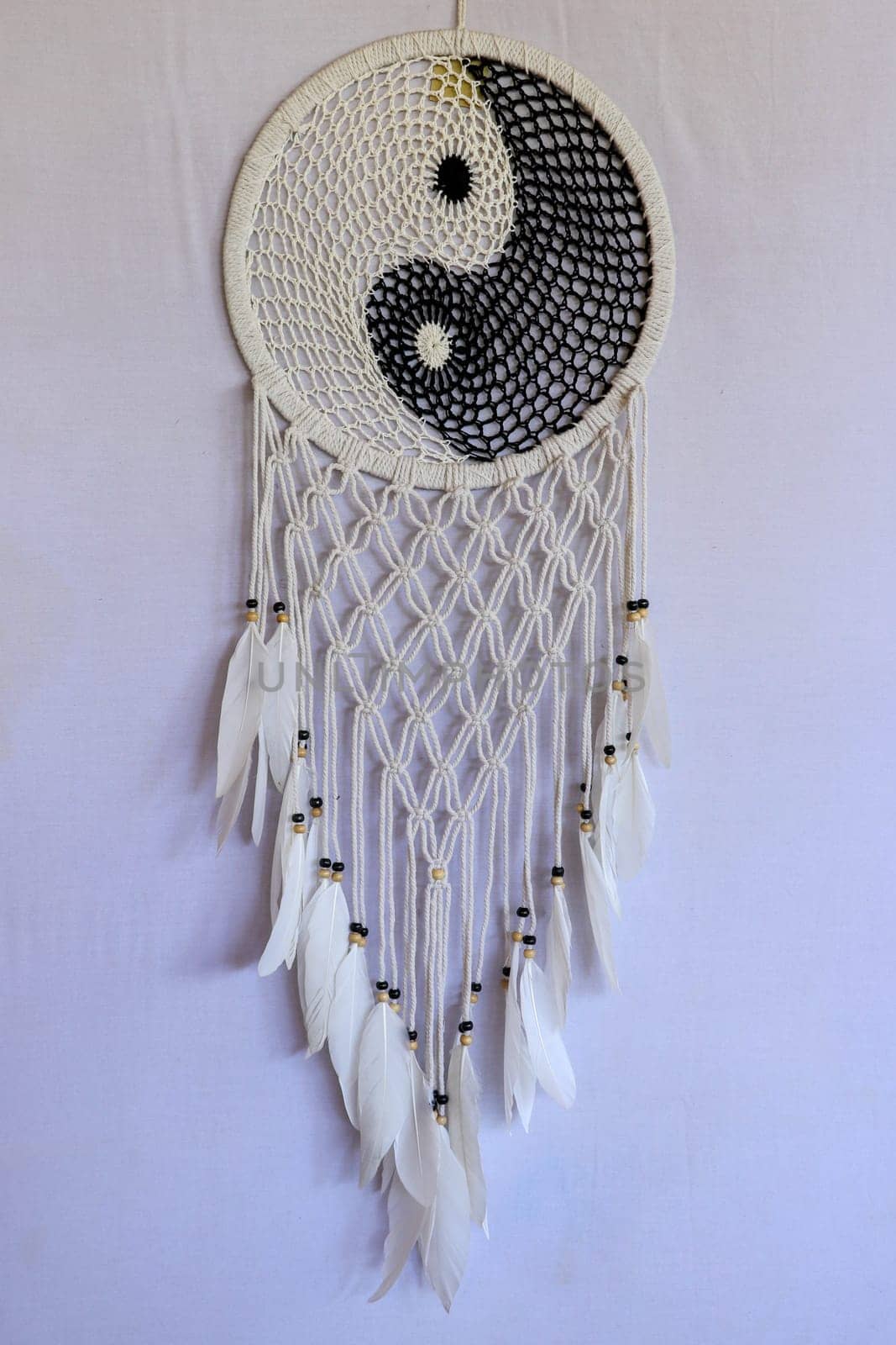 White and black dream catcher Yin Yang. Knitted Indian amulet.