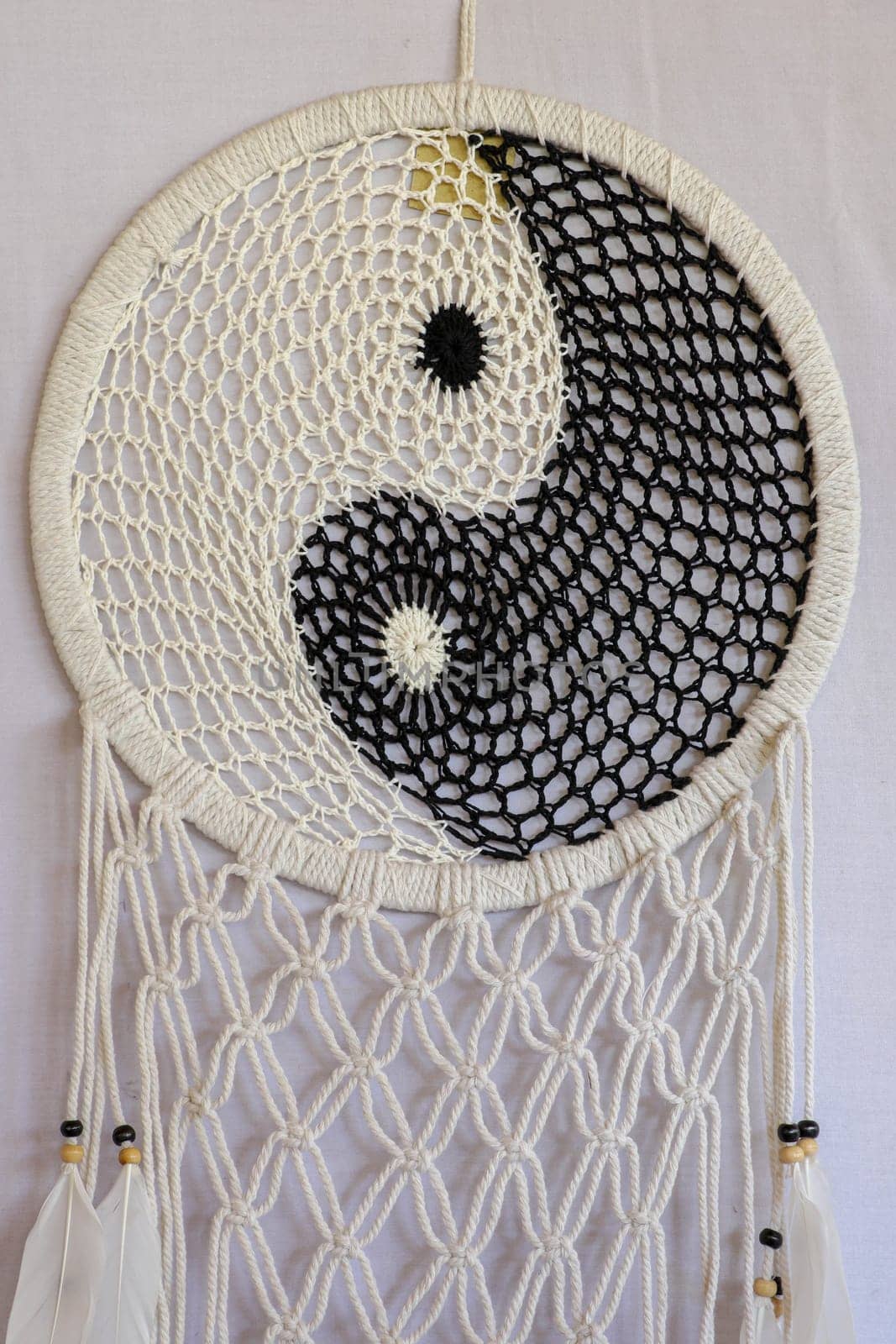 White and black dream catcher Yin Yang. Knitted Indian amulet.