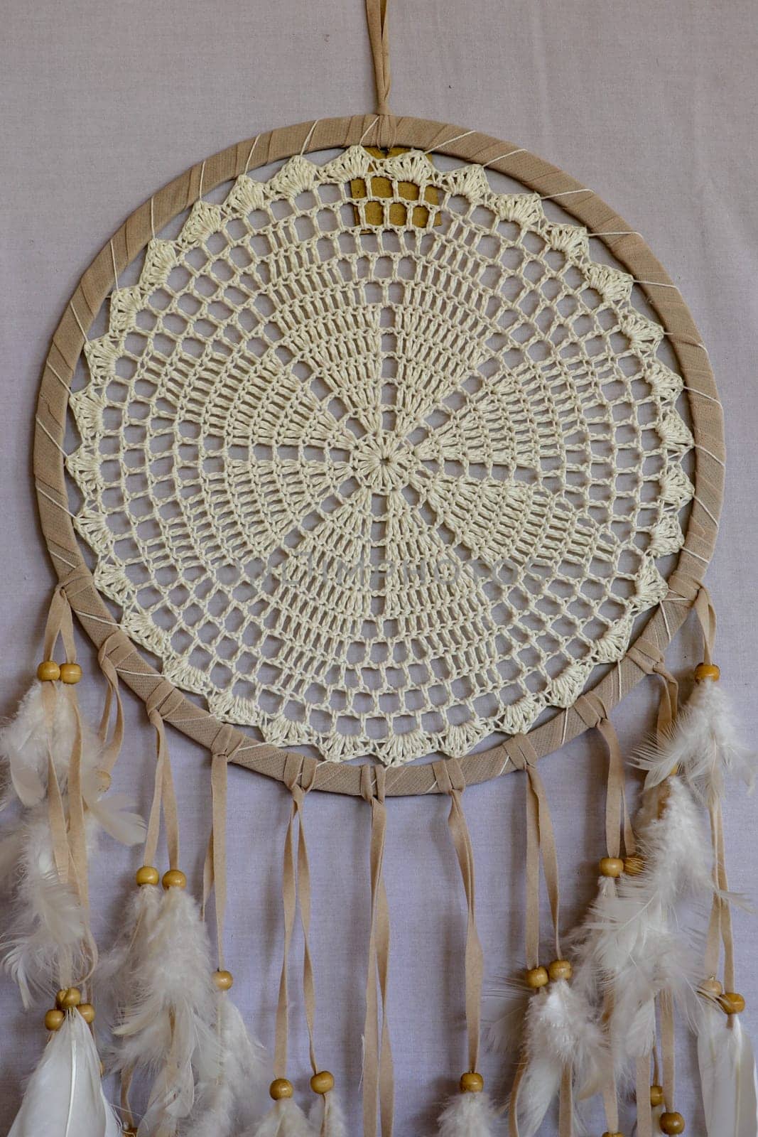 White color dream catcher with white feathers in the interior. Home Decor Concept..