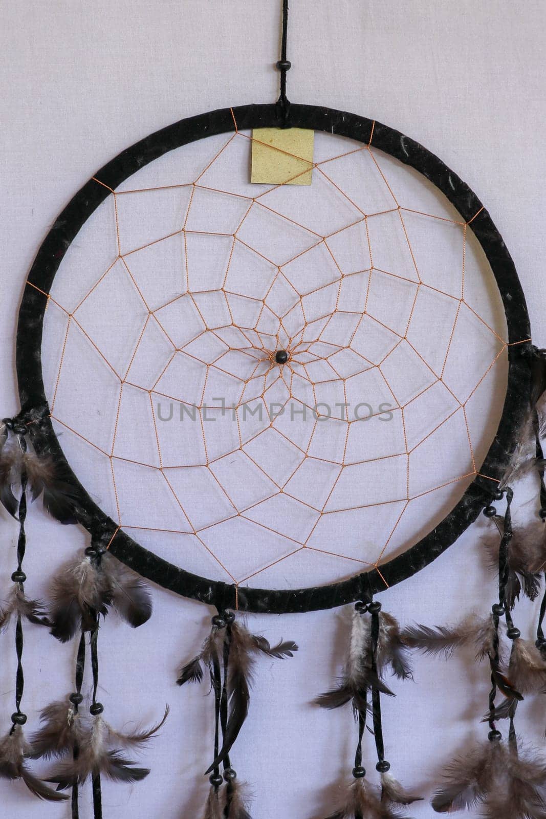 Black dream catcher photo on white background.
