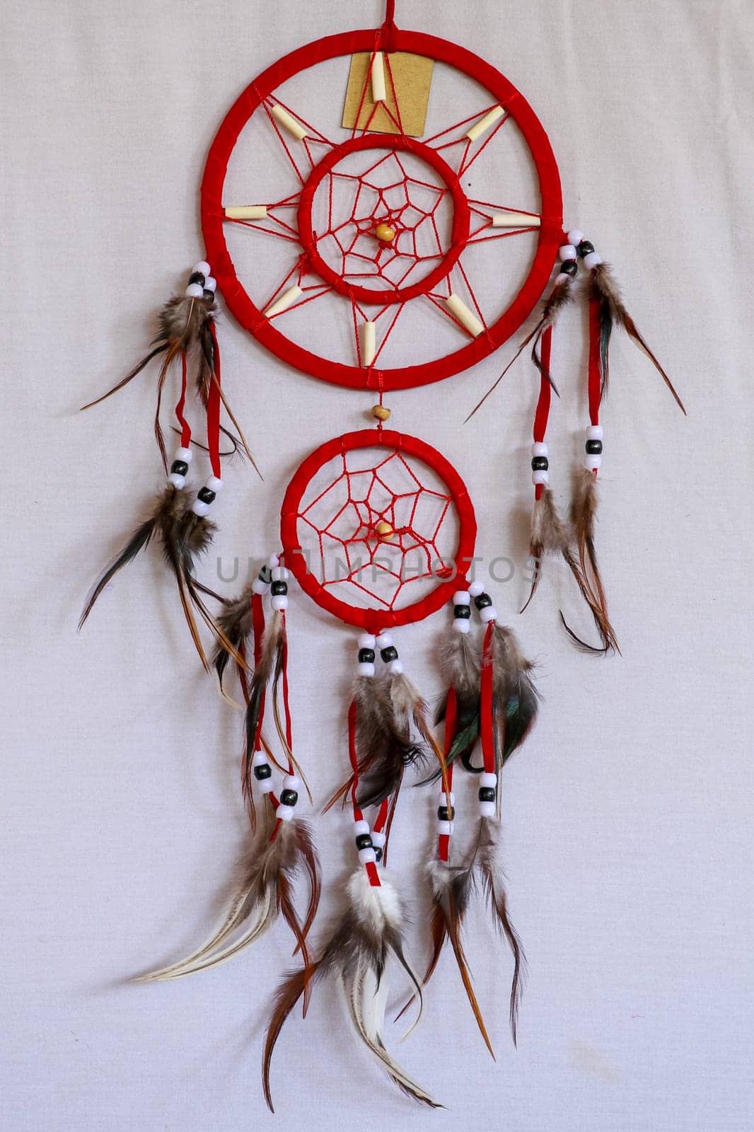 Red white blue Dreamcatcher on white background.