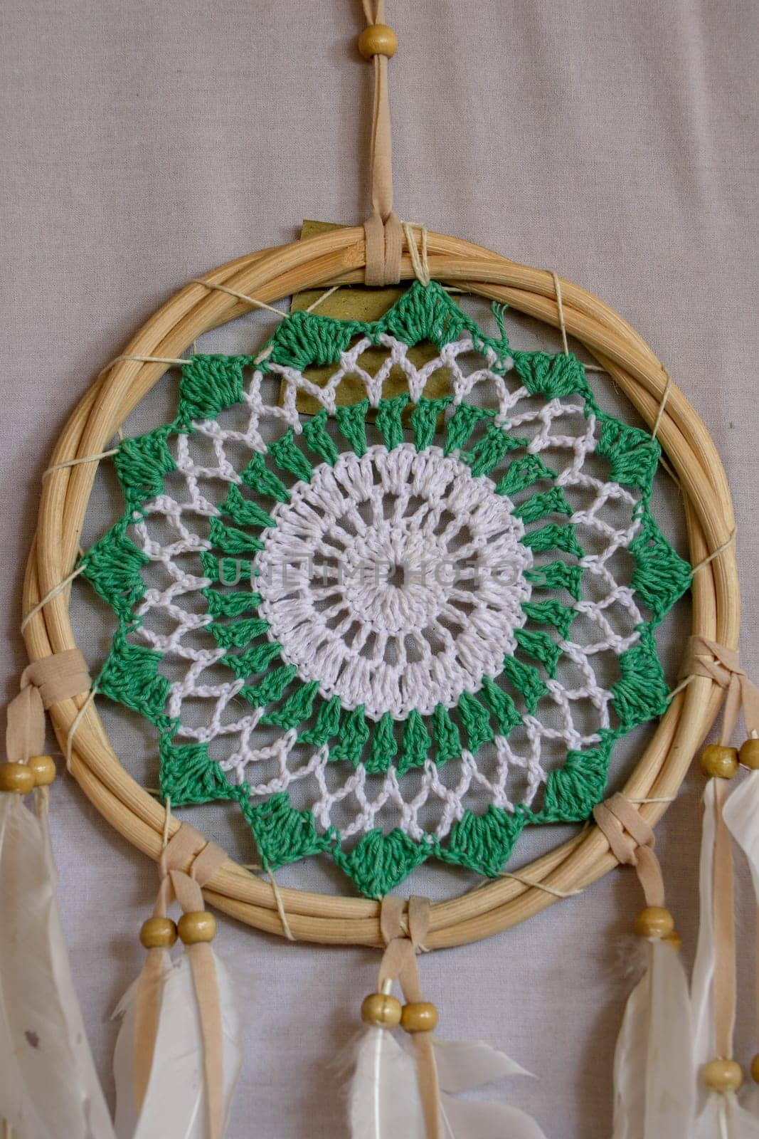 Beautiful green dream catcher on white background.
