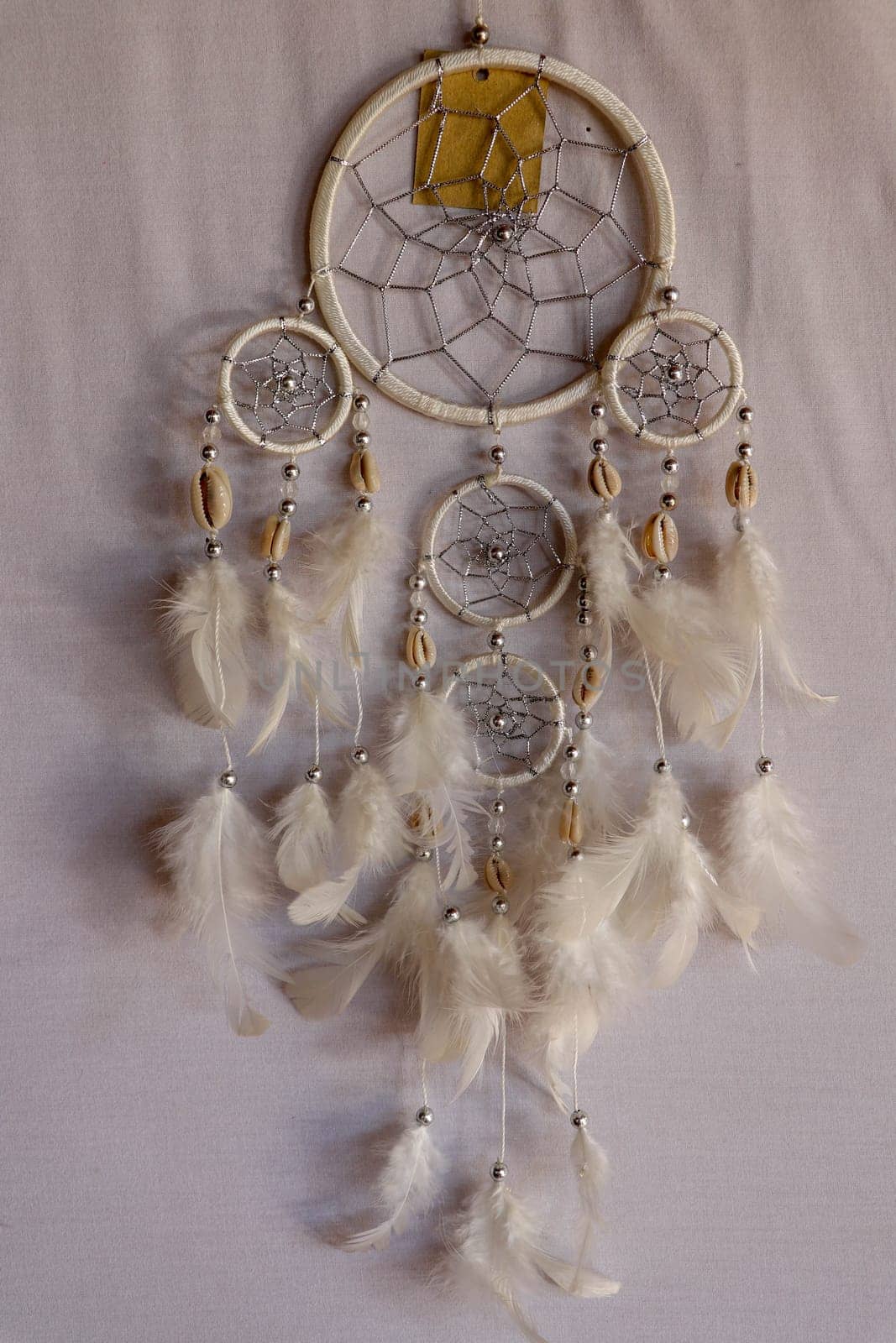 White color dream catcher with white feathers in the interior. Home Decor Concept..