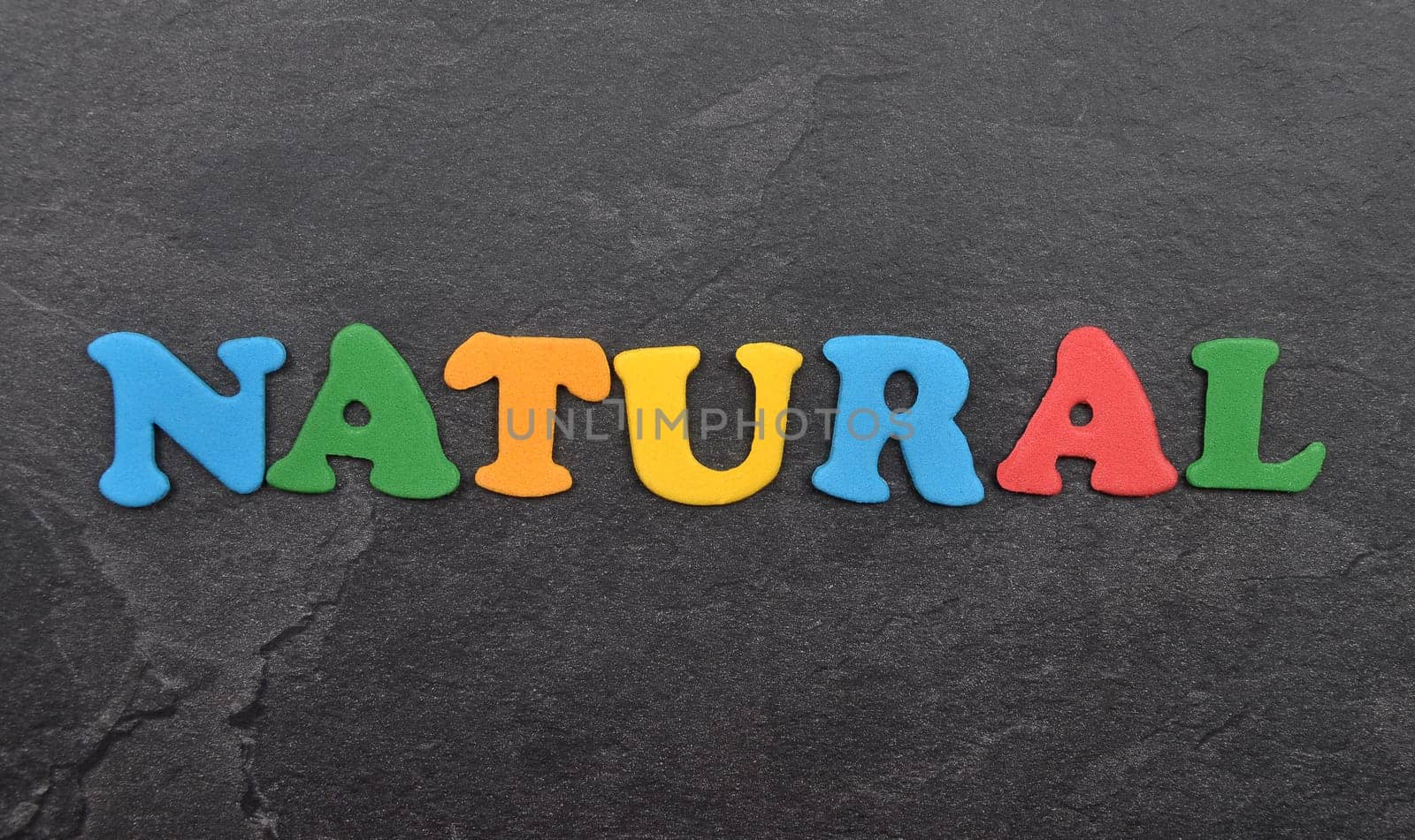 Term from colorful letters on slate board