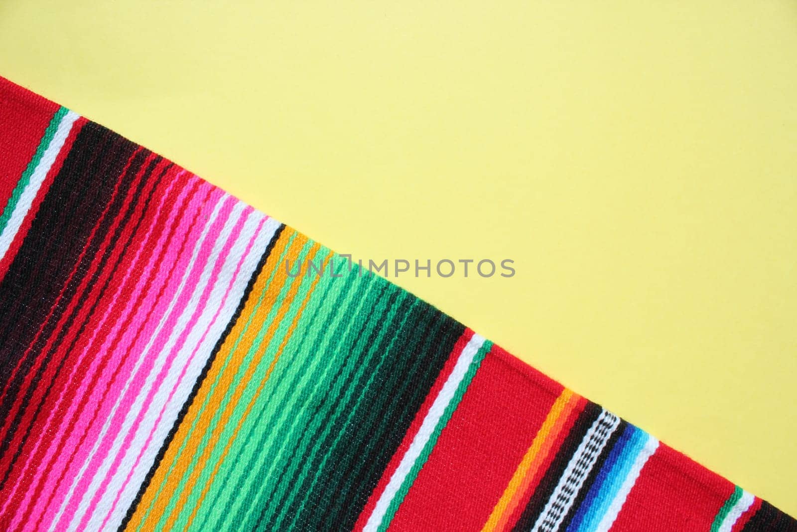 poncho Mexican cinco de mayo rug serape fiesta traditional Mexico background with stripes copy space maya blanket minimal simple -  stock, photo, photograph, image, picture