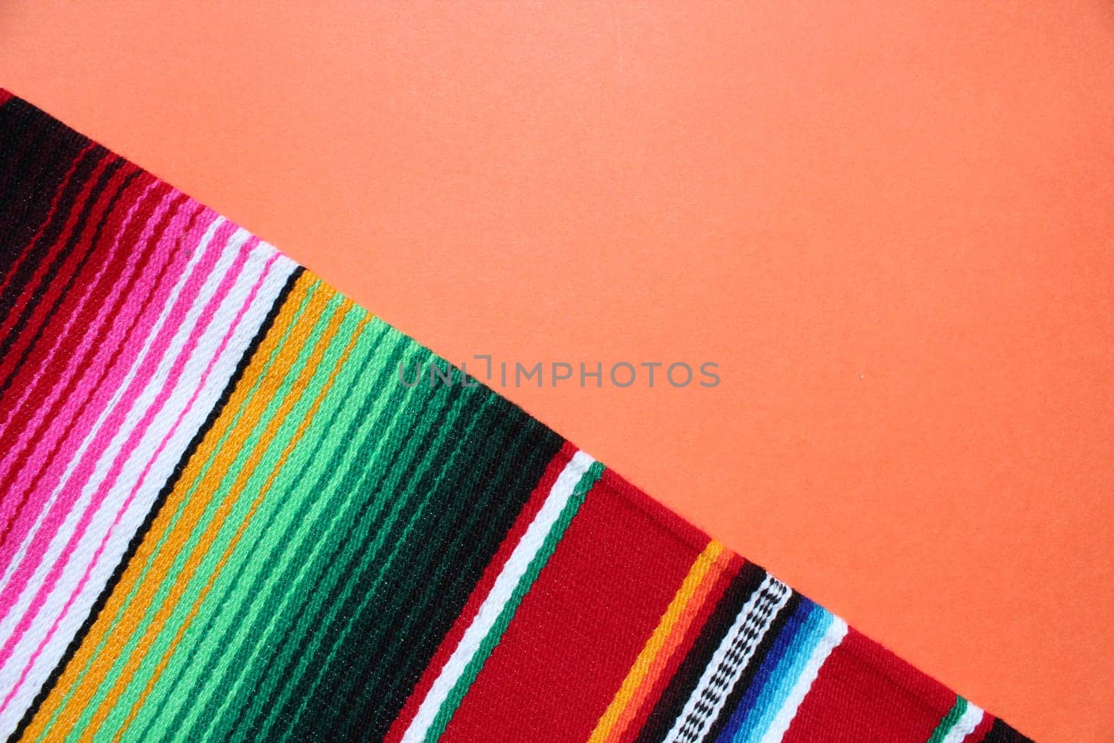 poncho Mexican cinco de mayo rug serape fiesta traditional Mexico background with stripes copy space maya blanket minimal simple -  stock, photo, photograph, image, picture