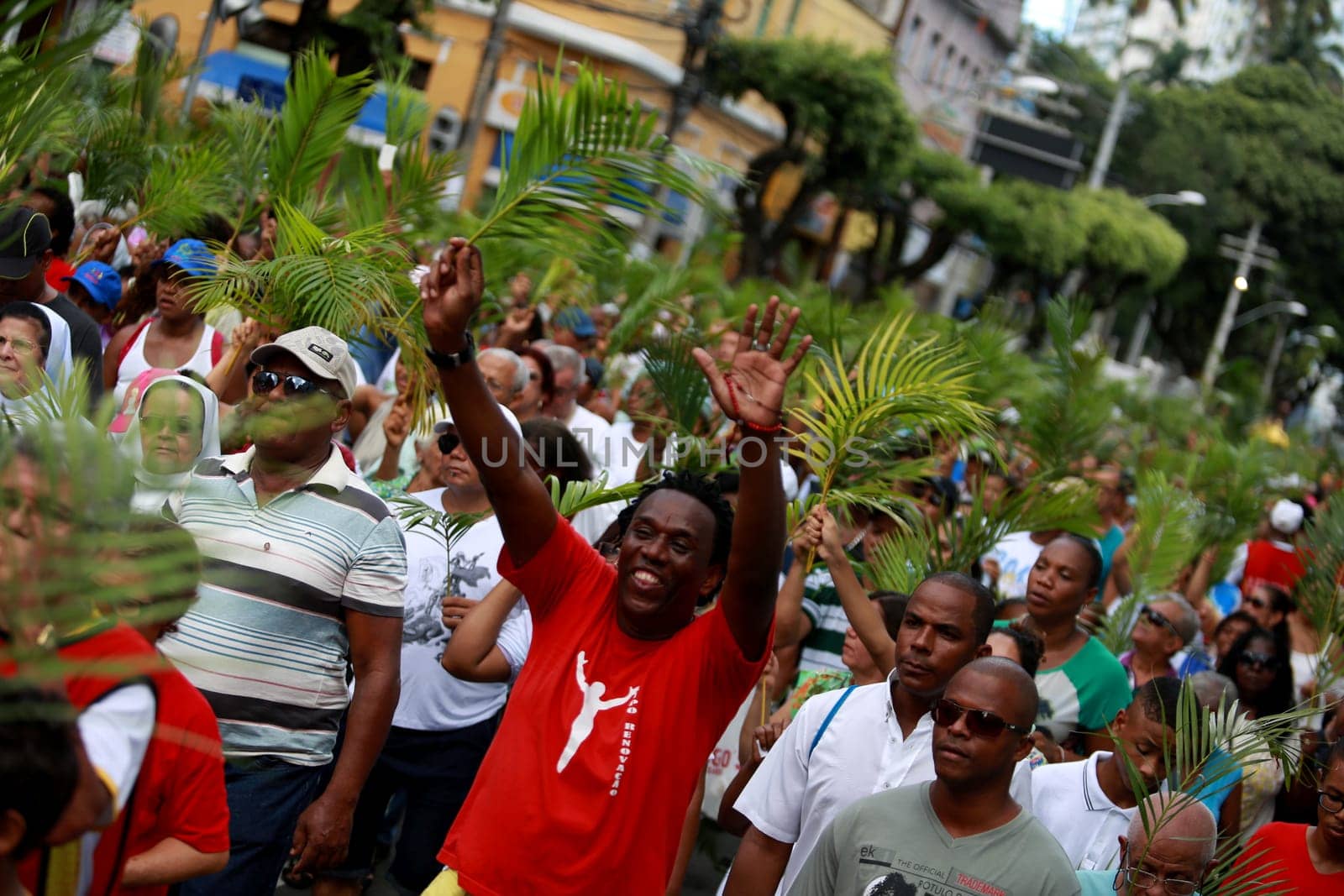 salvador, bahia / brazil - march 29, 2015: Catholics are seen carrying palm branches during Ramos procession in the city of Salvador. The Christian feast, celebrated on the Sunday before Easter, symbolizes the entry of Jesus Christ into Jerusalem..