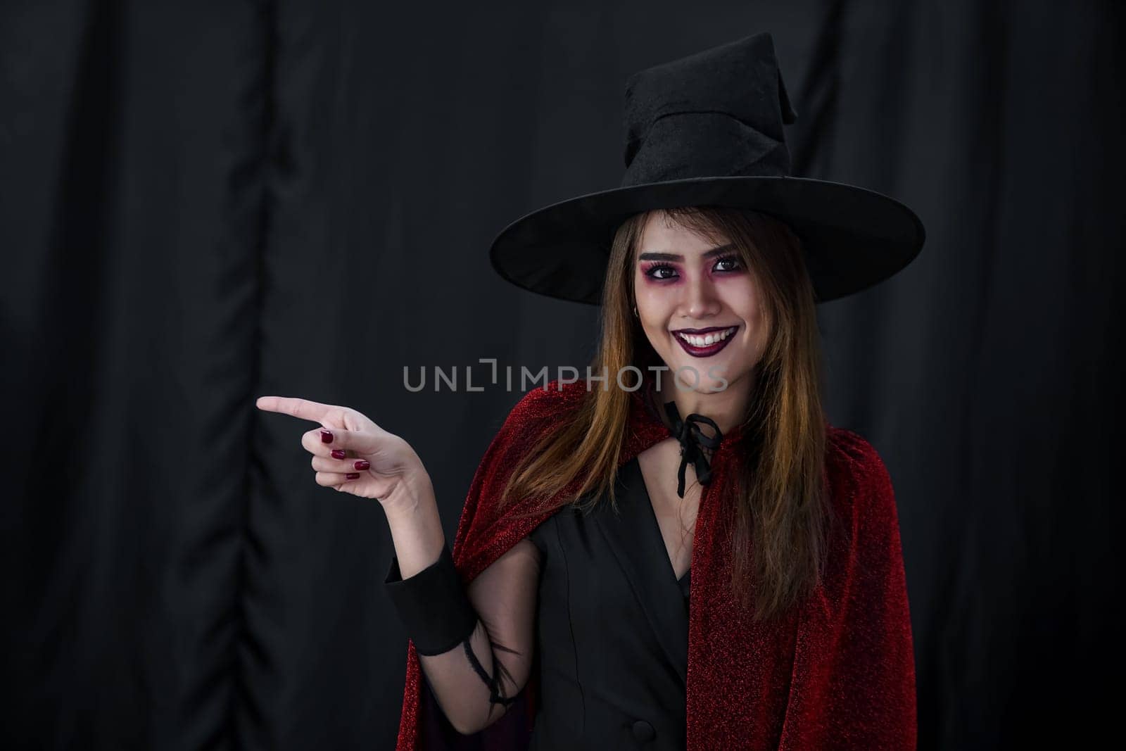 Portrait of asian young adult teenage woman wear Halloween costume cloth for Halloween party carnival. Halloween celebrate and international holiday concept.