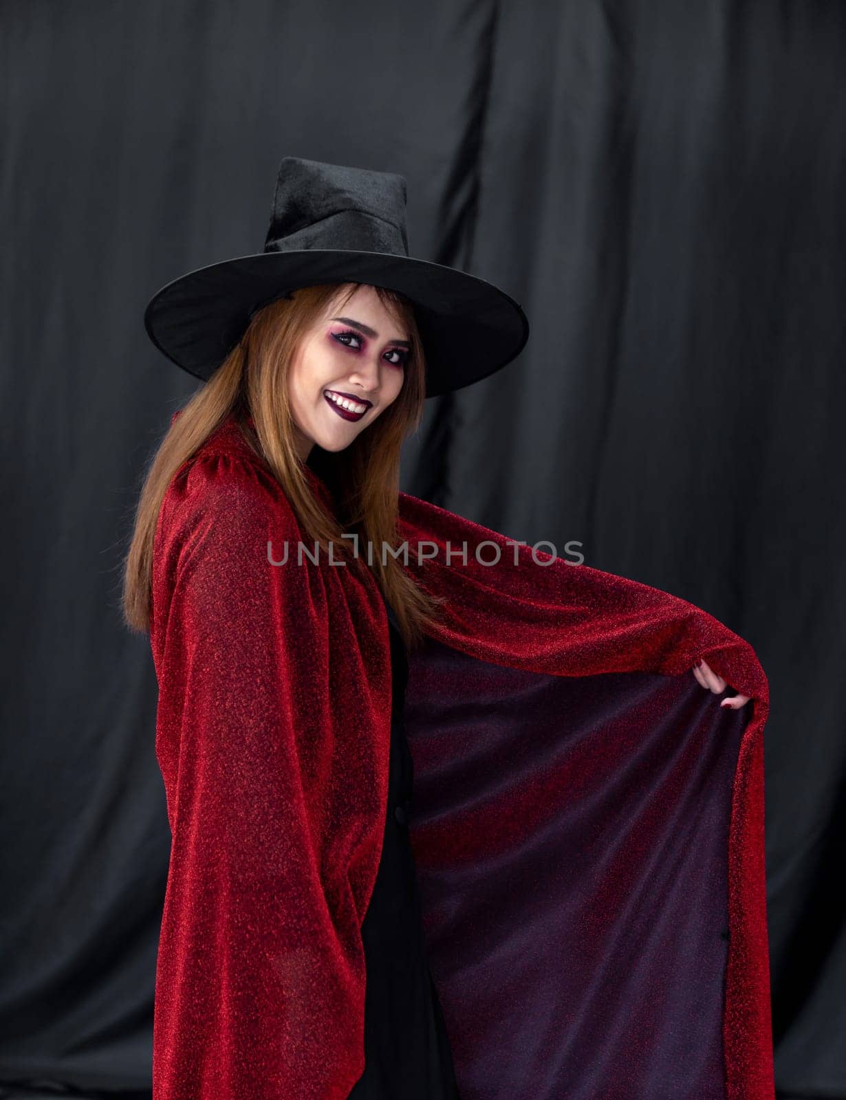 Portrait of asian young adult teenage woman wear Halloween costume cloth for Halloween party carnival. Halloween celebrate and international holiday concept.