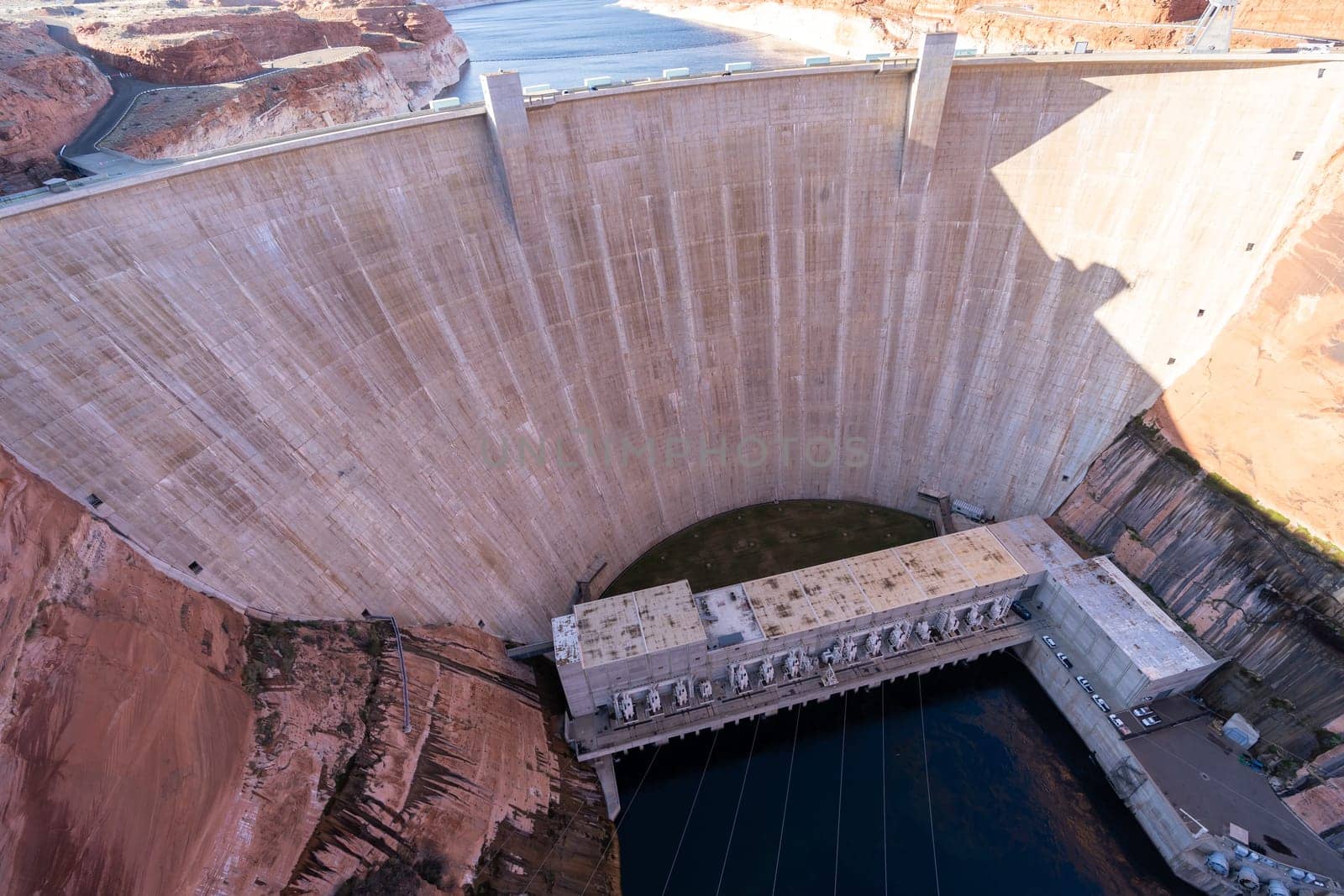 Glen Canyon Dam with Lake Powell in the Desert rural area of Page city Arizona, United States. USA Landmark environmental water resources reservoir and electricity concept.