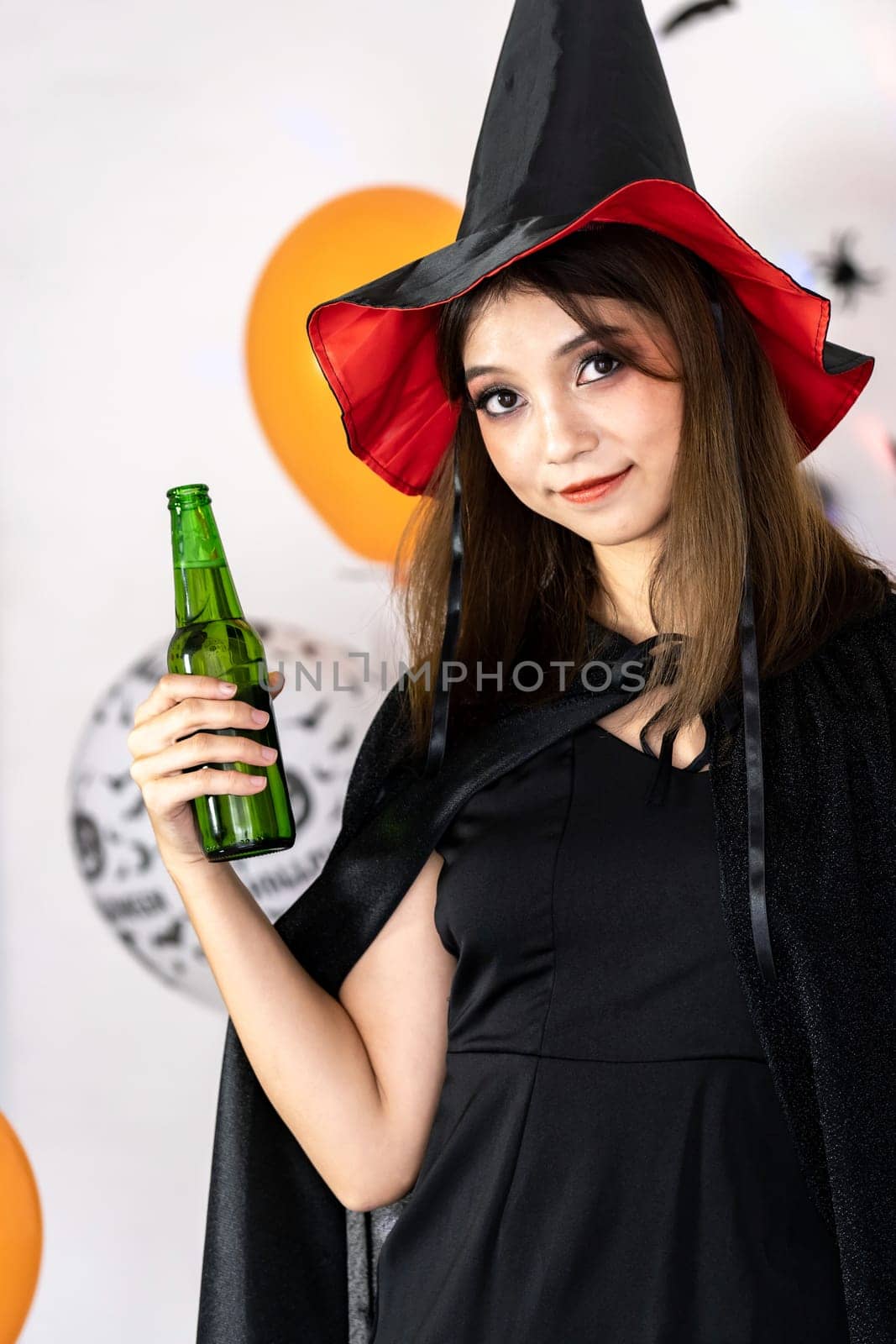 Portrait of asian young adult teenage woman wear Halloween costume cloth for Halloween party carnival. Halloween celebrate and international holiday concept.