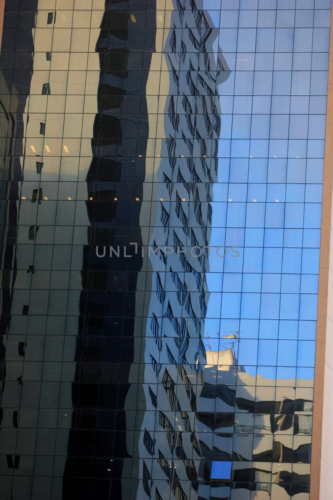 salvador, bahia / brazil - september 23, 2015: reflections of the street are seen in a mirrored building in the city of Salvador.