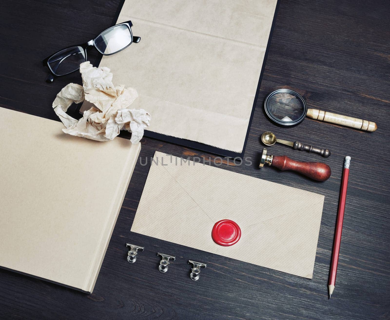 Old blank retro stationery on wooden background.