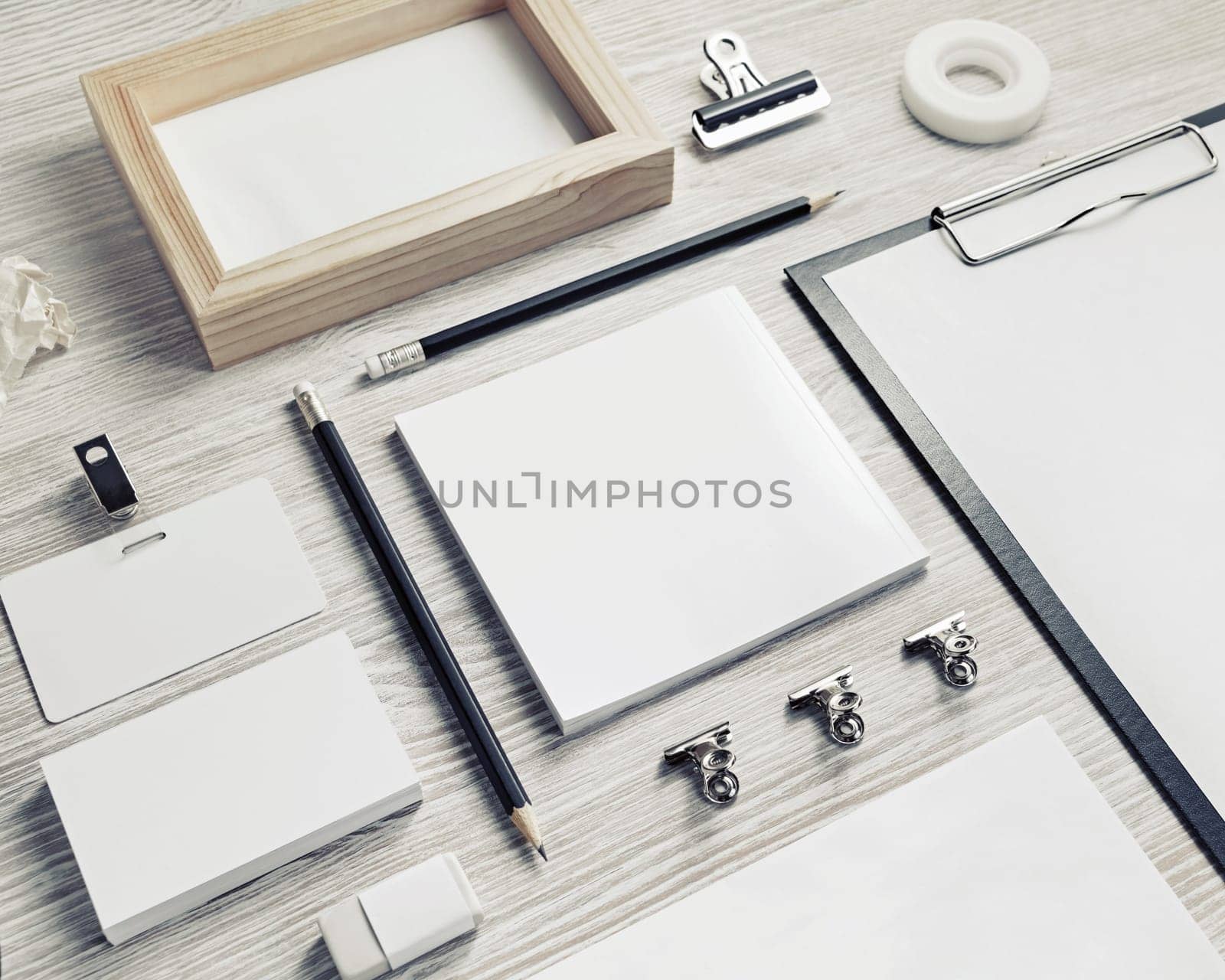 Business stationery mock-up. Blank corporate identity template on light wood table background.