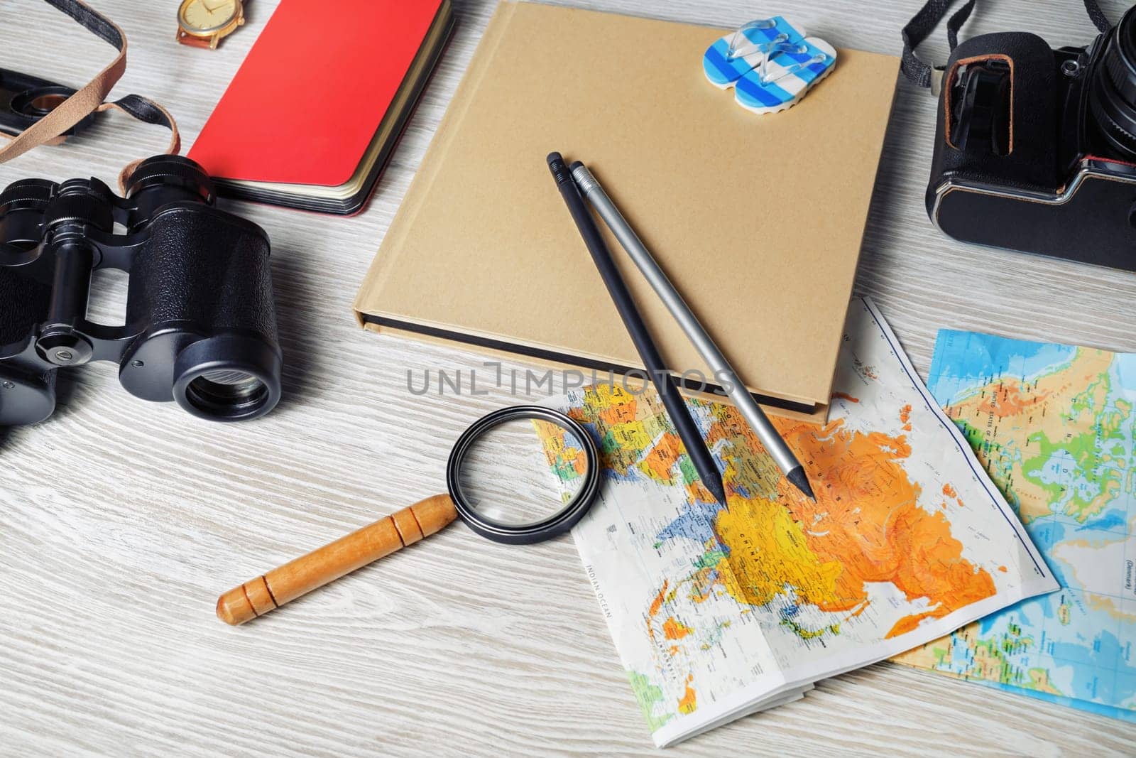 Trip vacation concept. Travel plan. Traveler accessories and items on light wooden background.